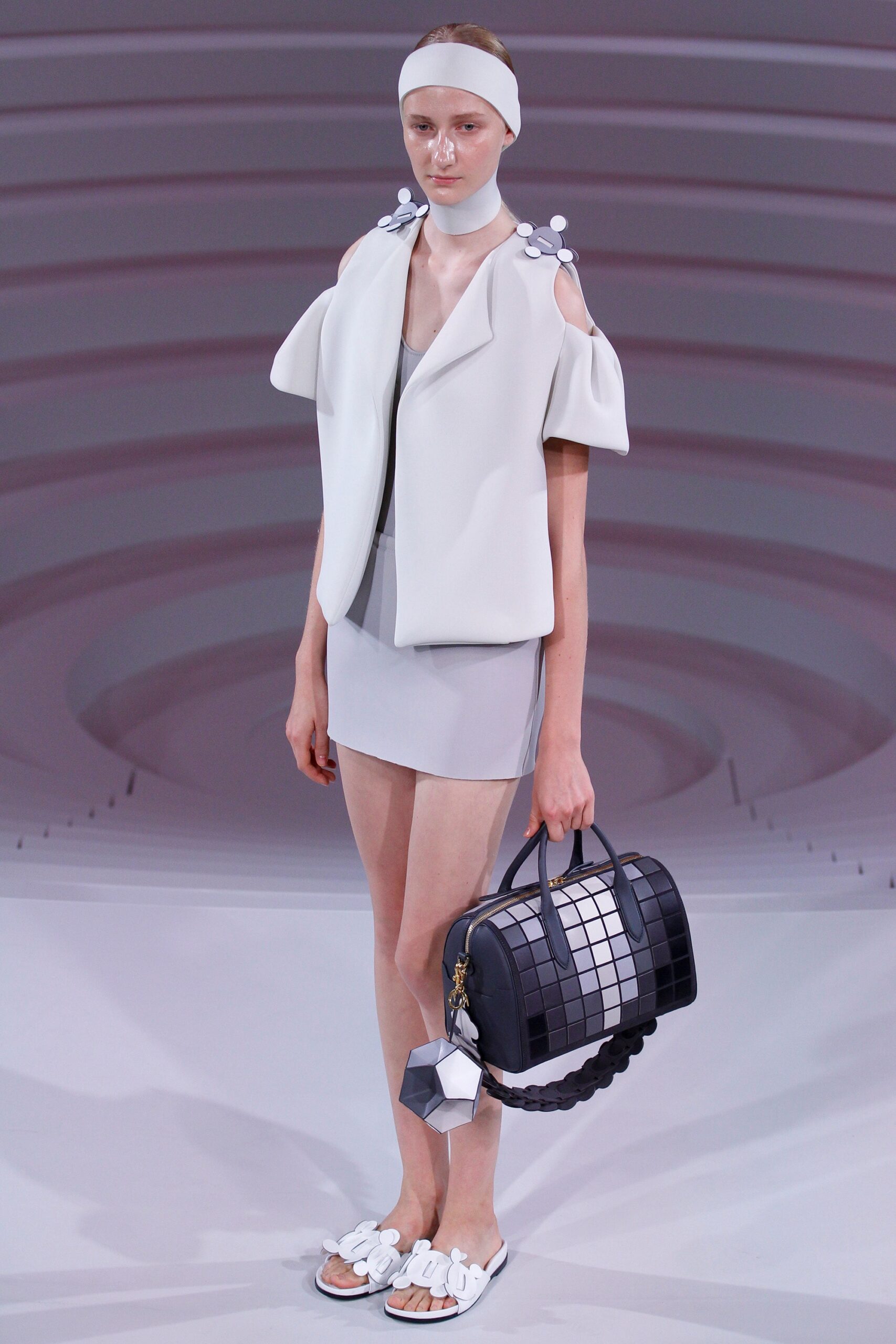 white neoprene jacket and gray dress
