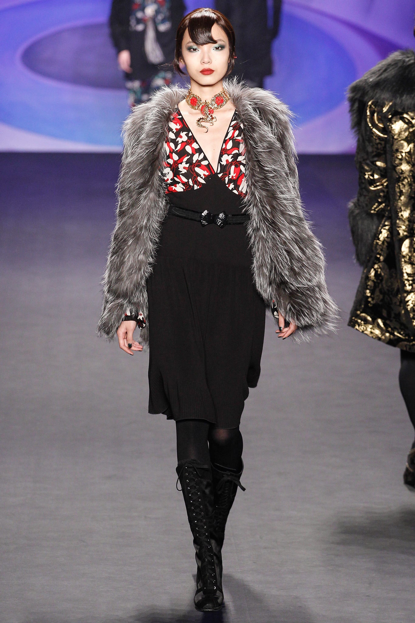 black silk sleeveless dress with gray faux-fur coat