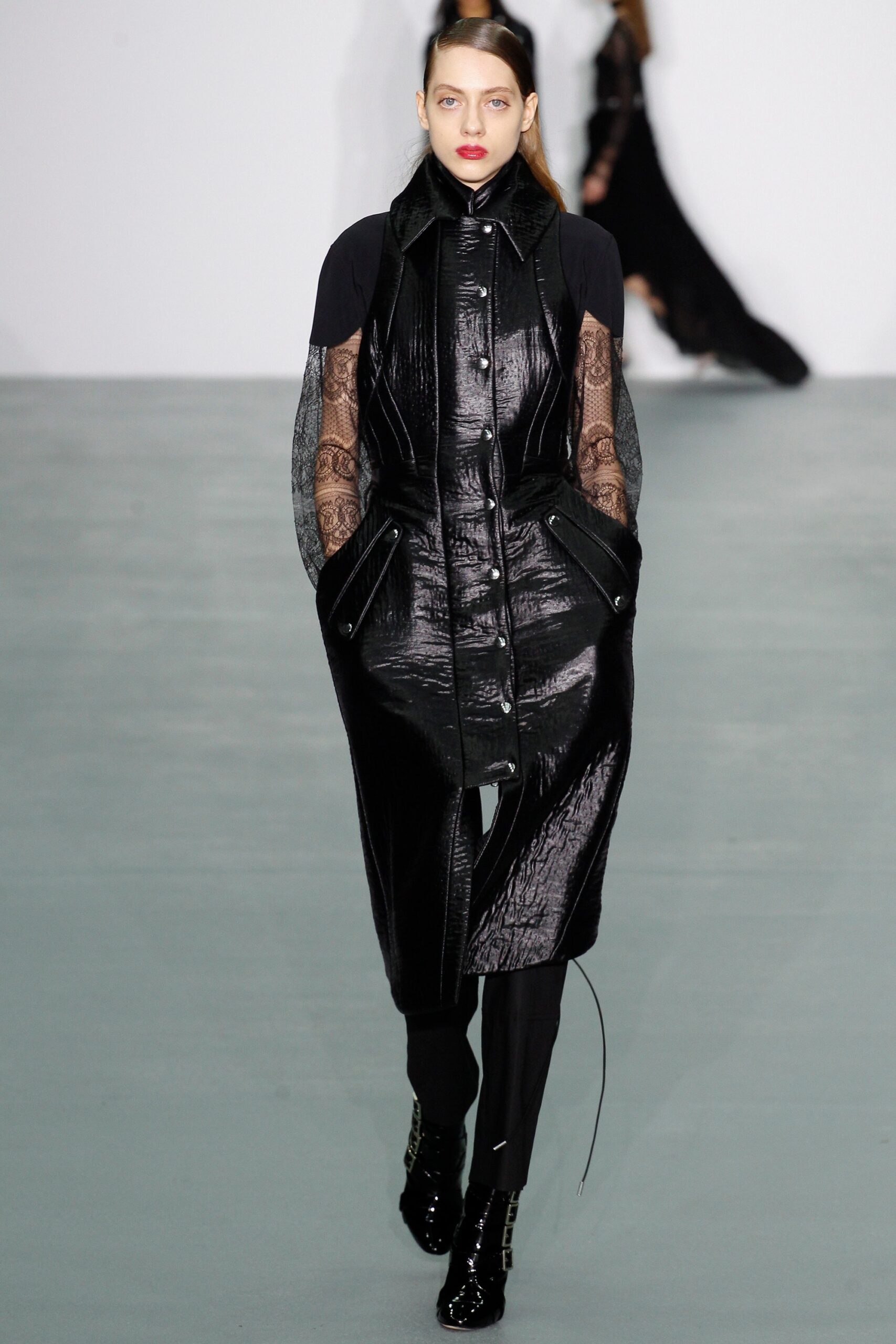 black leather fitted coat and slim pants