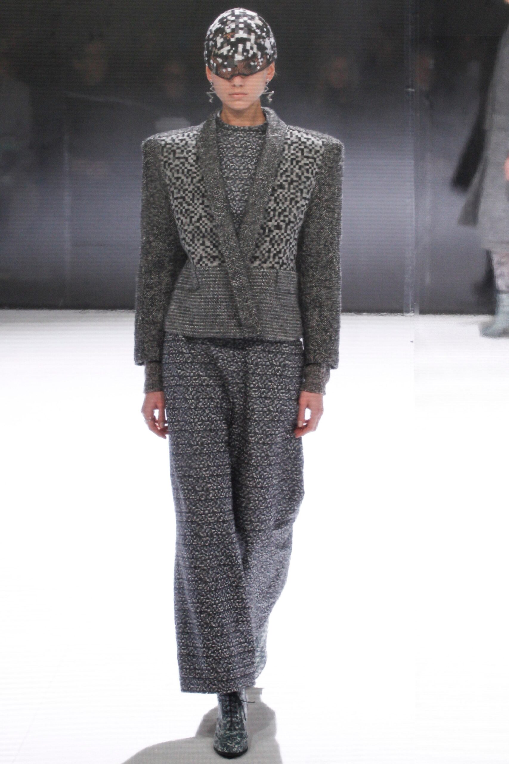 gray tailored suit with embellished hat