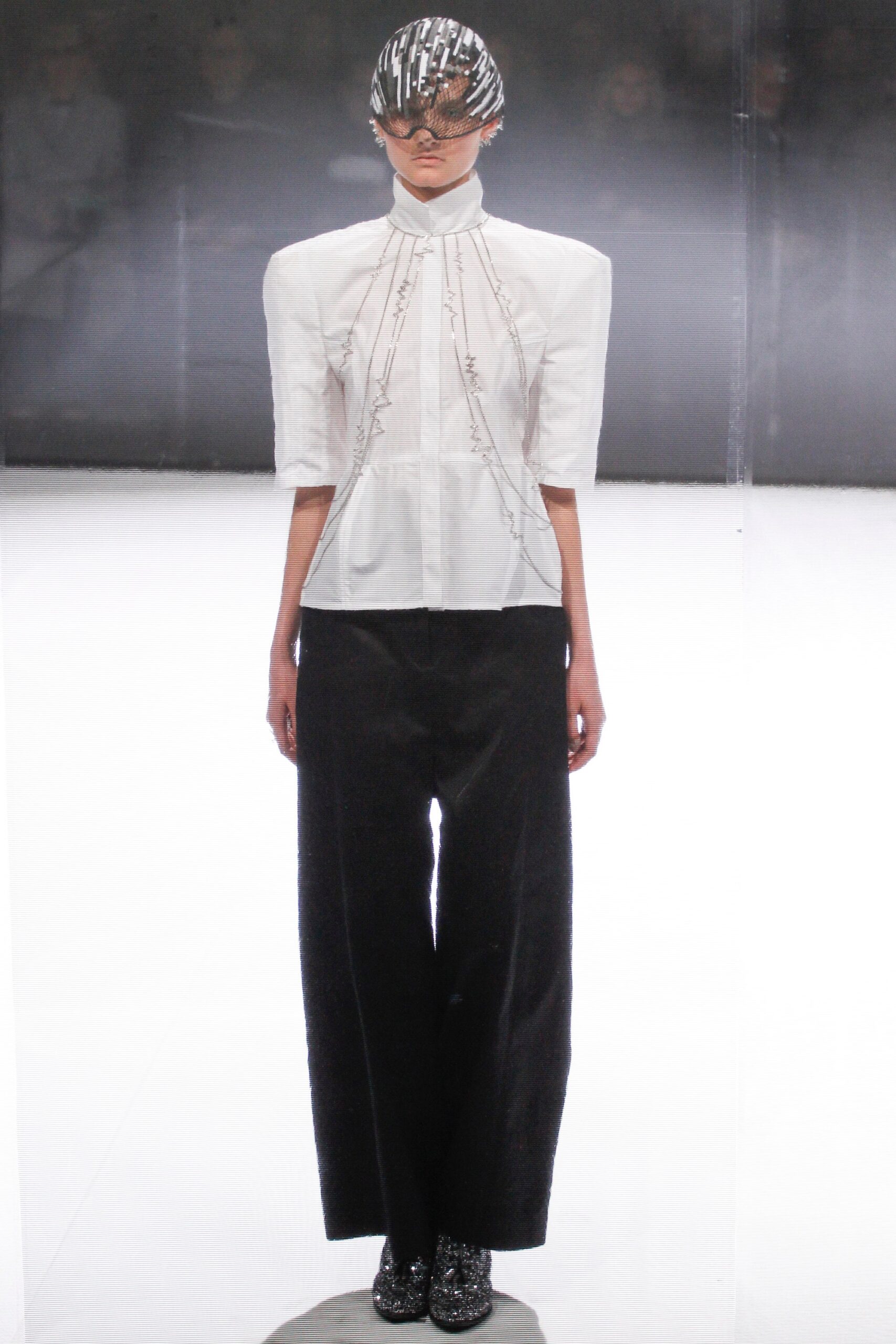 white fitted blouse and black wide-leg pants