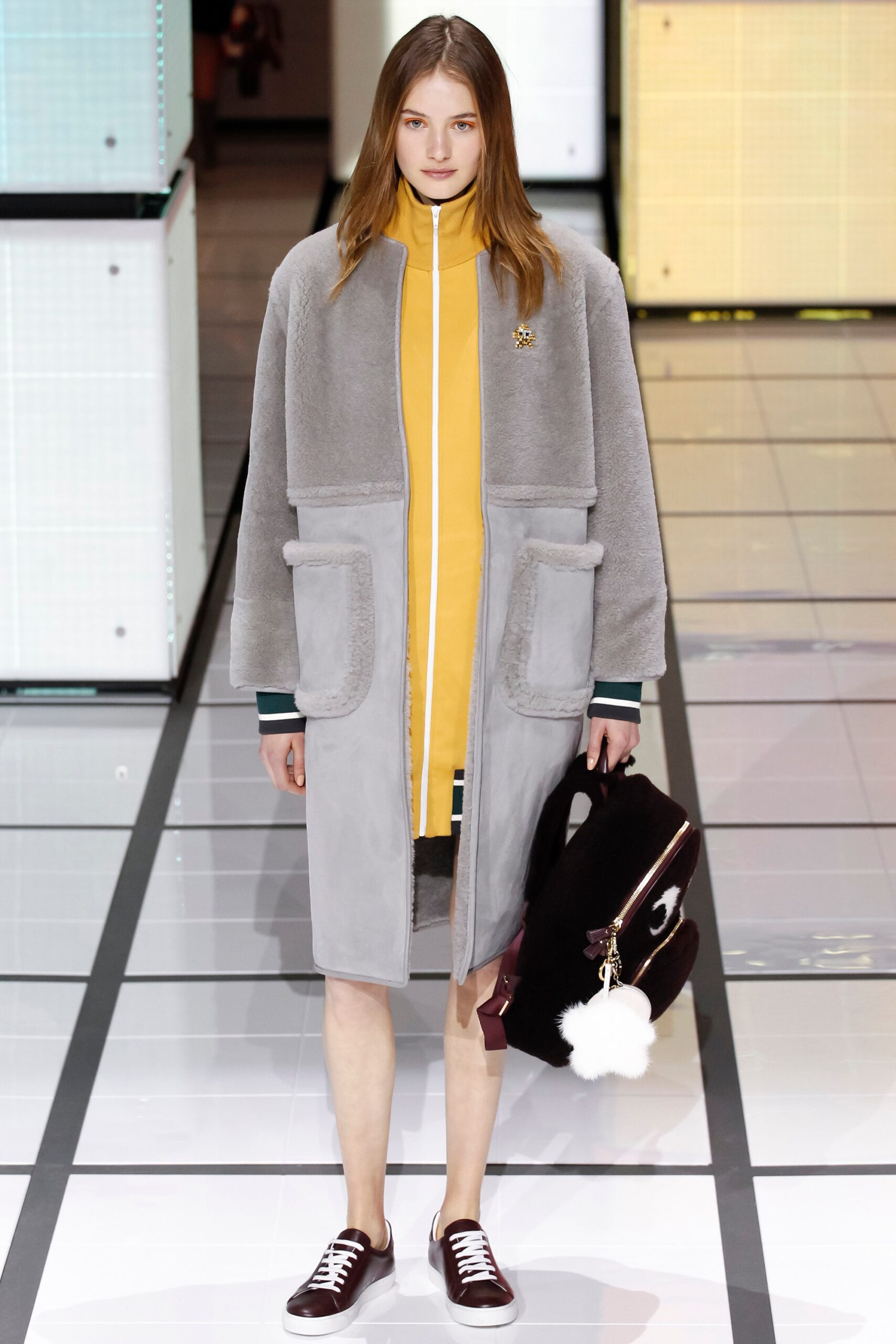 gray faux-fur coat with yellow dress