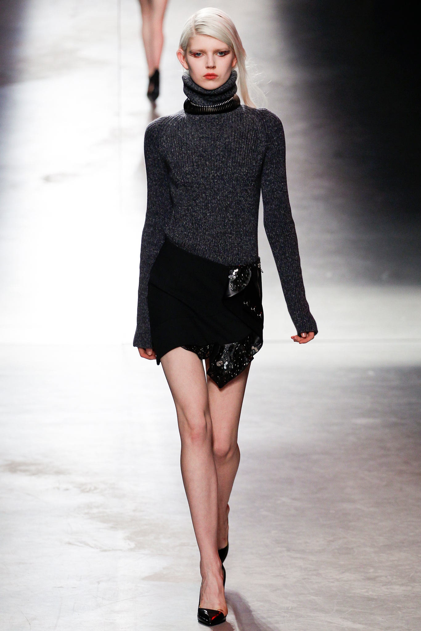 fitted gray turtleneck top with asymmetric black skirt