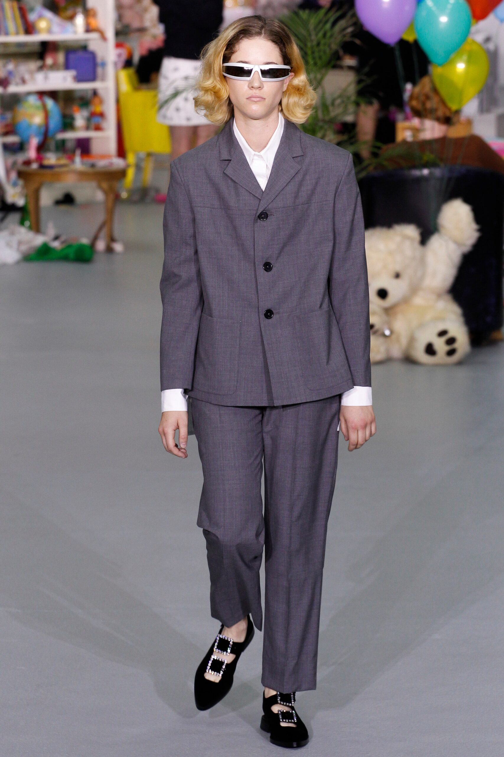 gray tailored suit with sunglasses