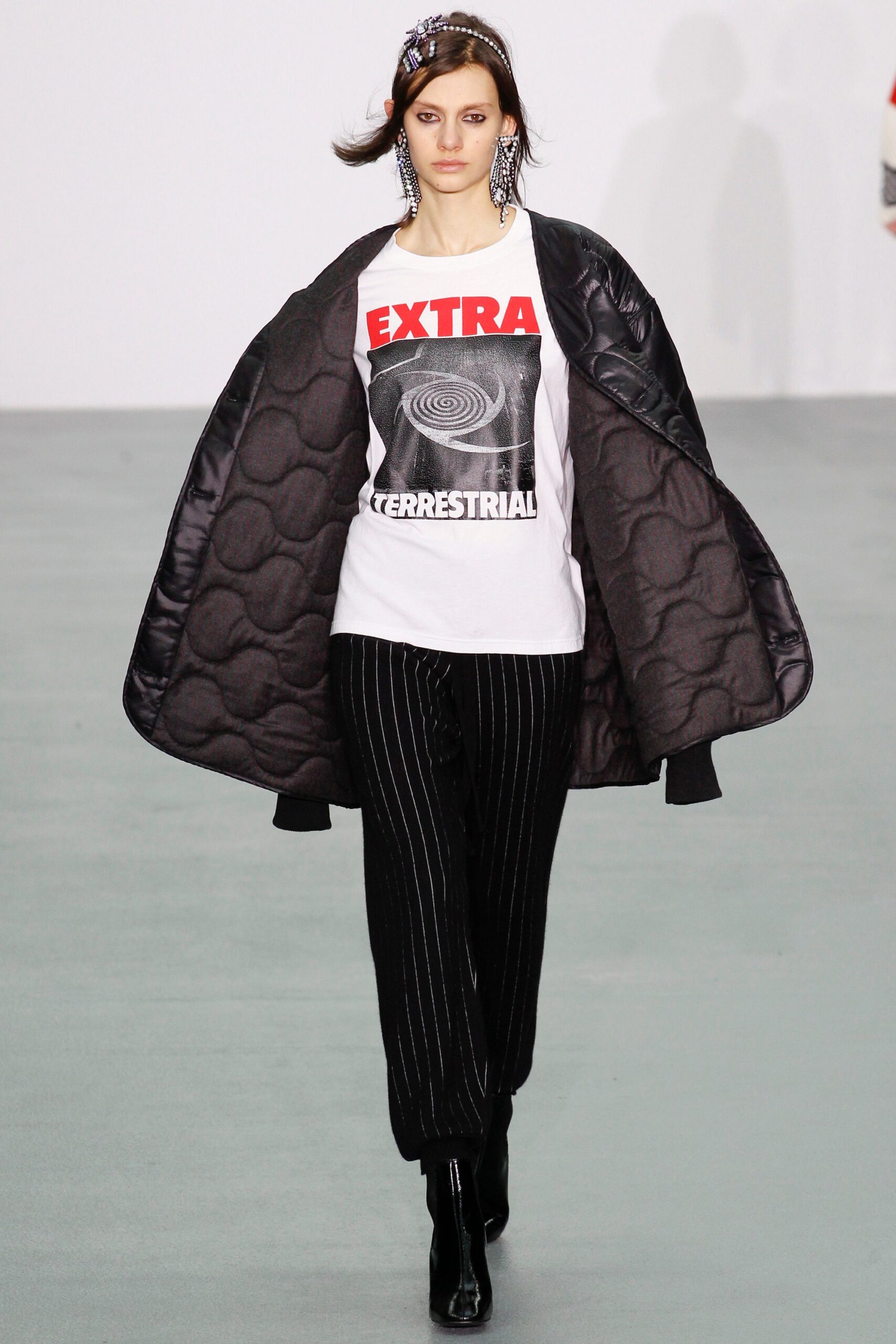 black vinyl coat with printed t-shirt