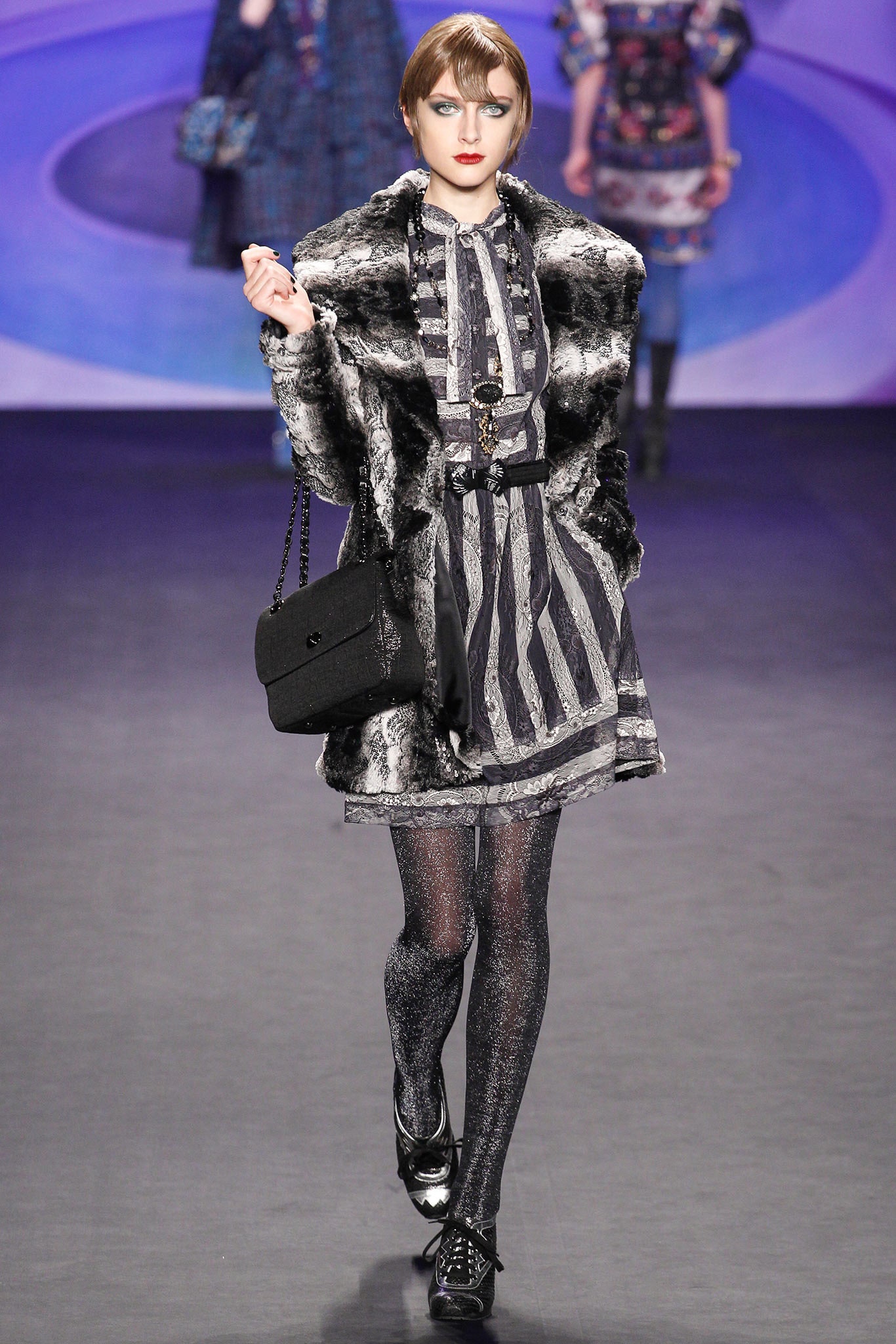 fitted black fur coat and mini dress