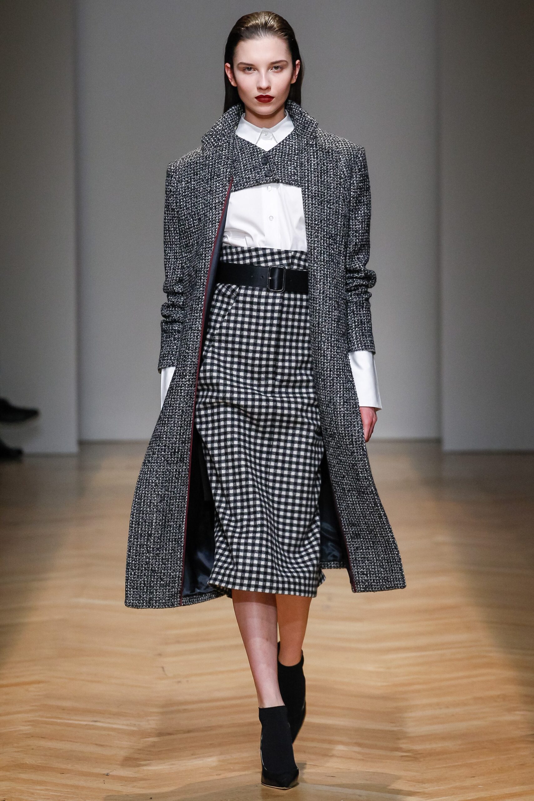black wool long-sleeve collared fitted buttoned layered coat