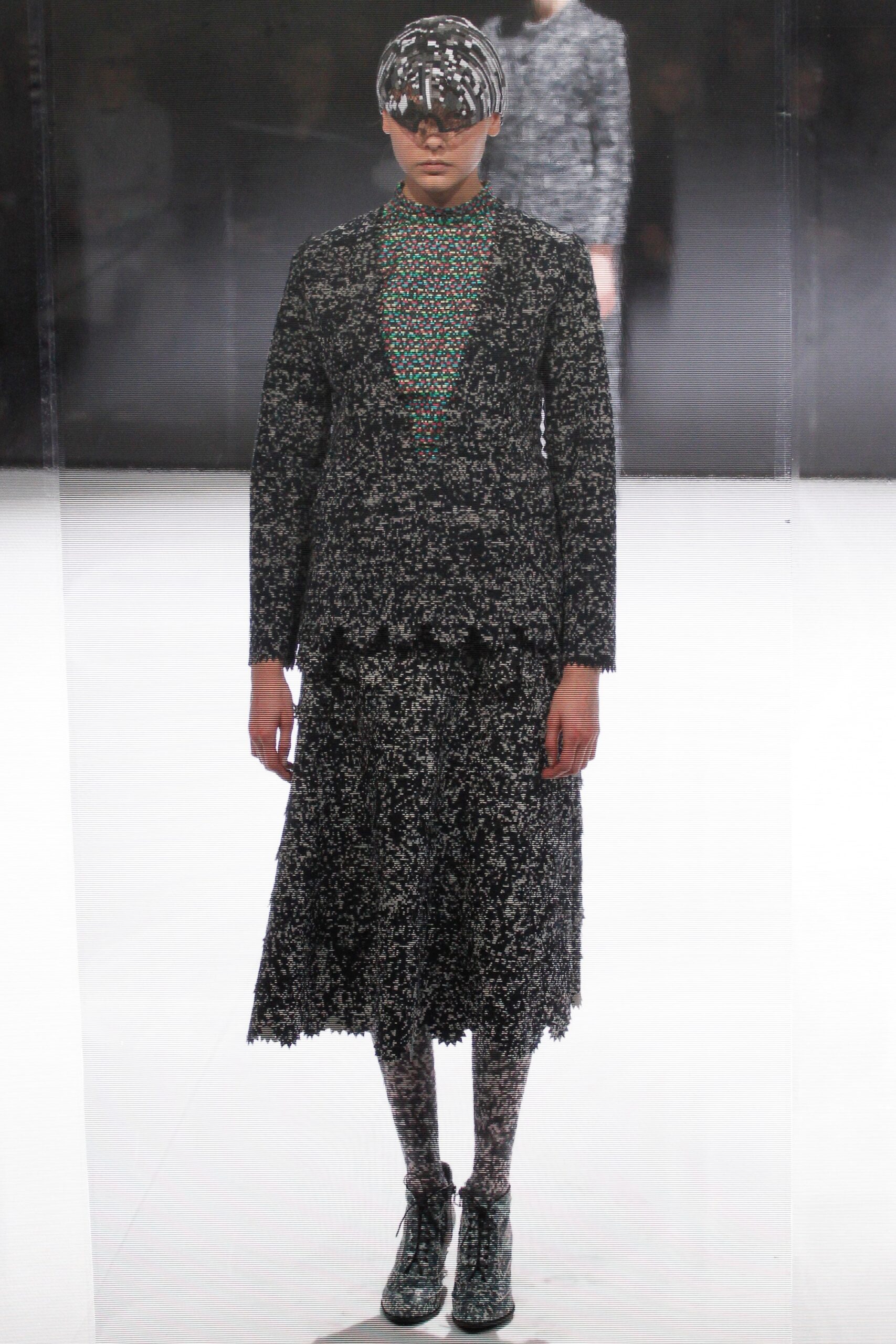 black and white layered top with pleated skirt