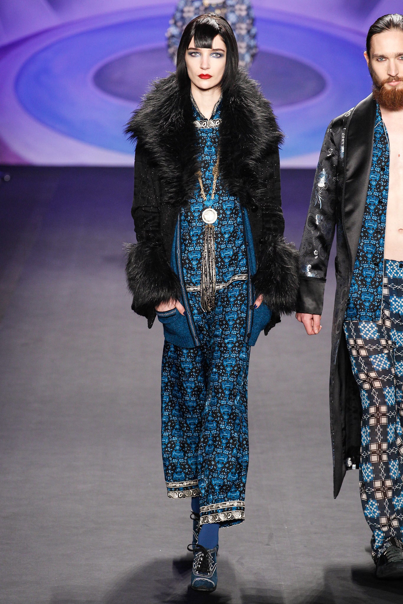 black fur coat and blue printed dress