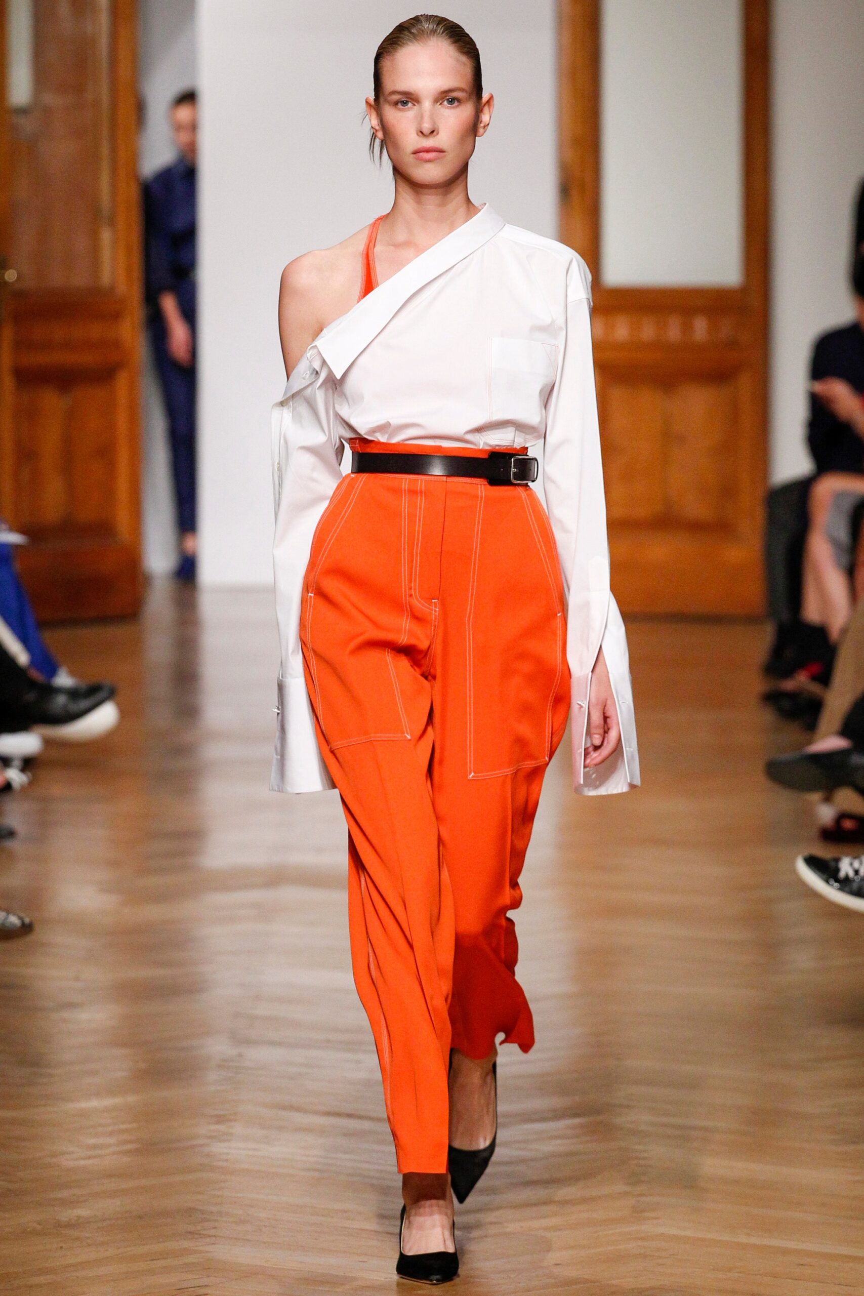 white off-shoulder shirt and orange pants