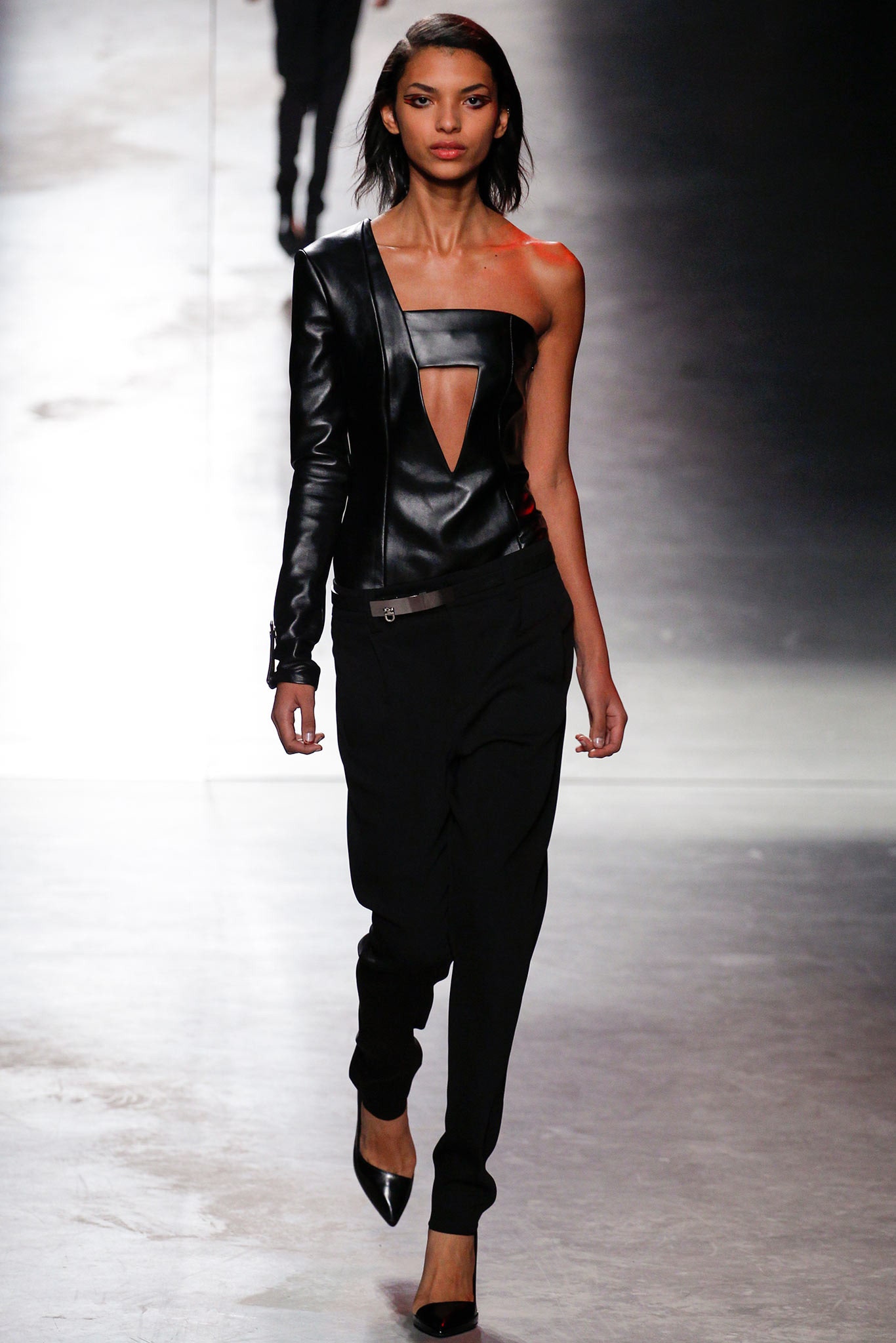 black leather fitted top and relaxed pants