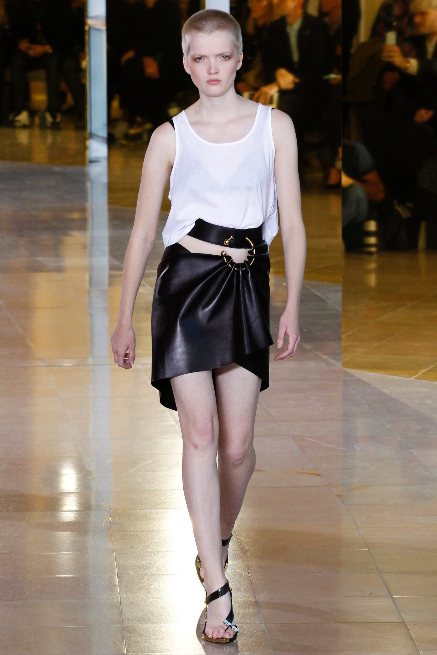 white fitted cropped top and black leather skirt