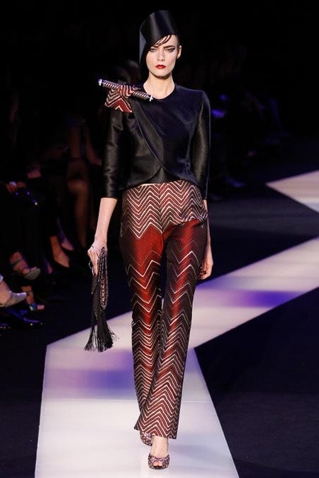 black silk asymmetric top with flared pants