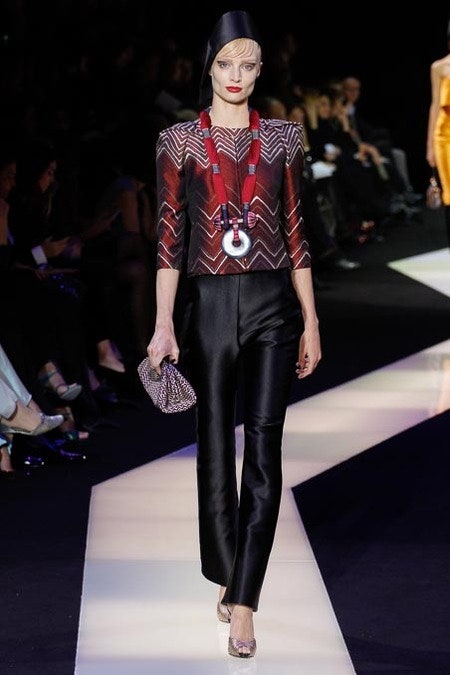 fitted red silk top with black pants