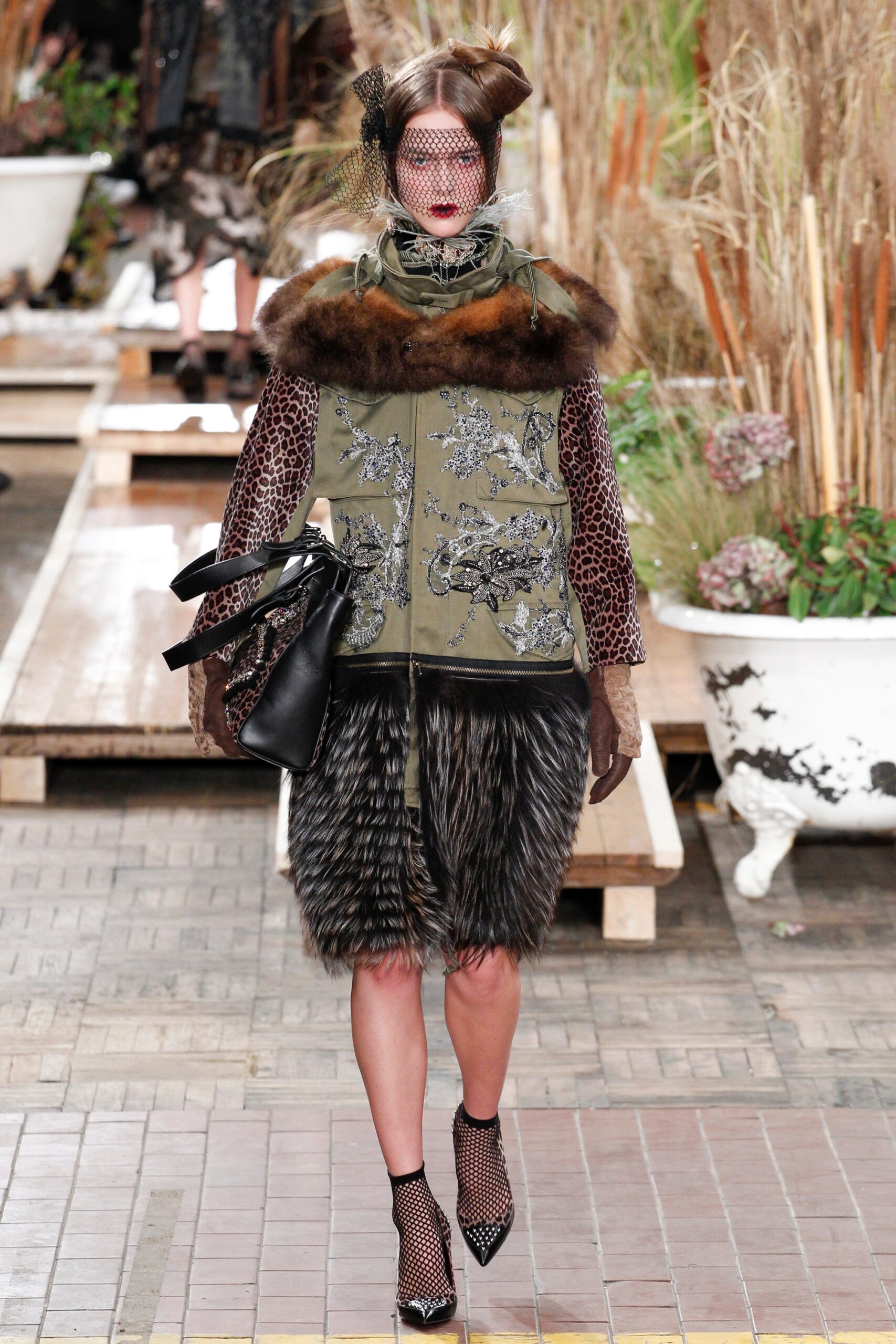 green embroidered coat with fur skirt