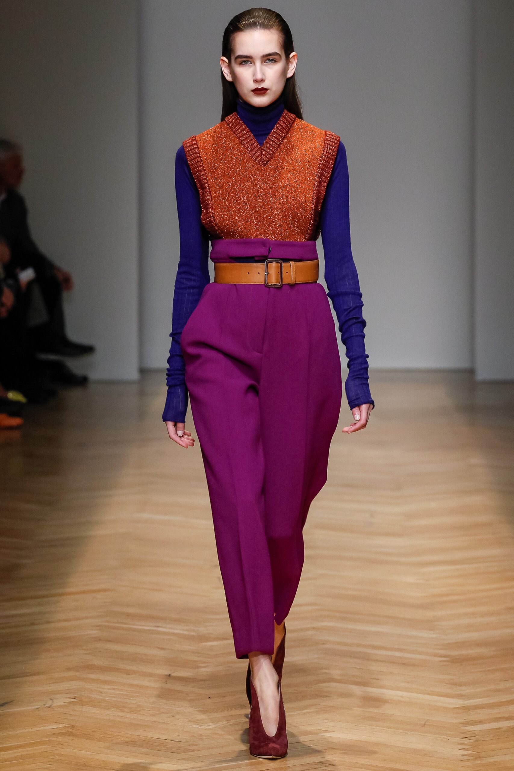 fitted orange purple sweater with tailored pants
