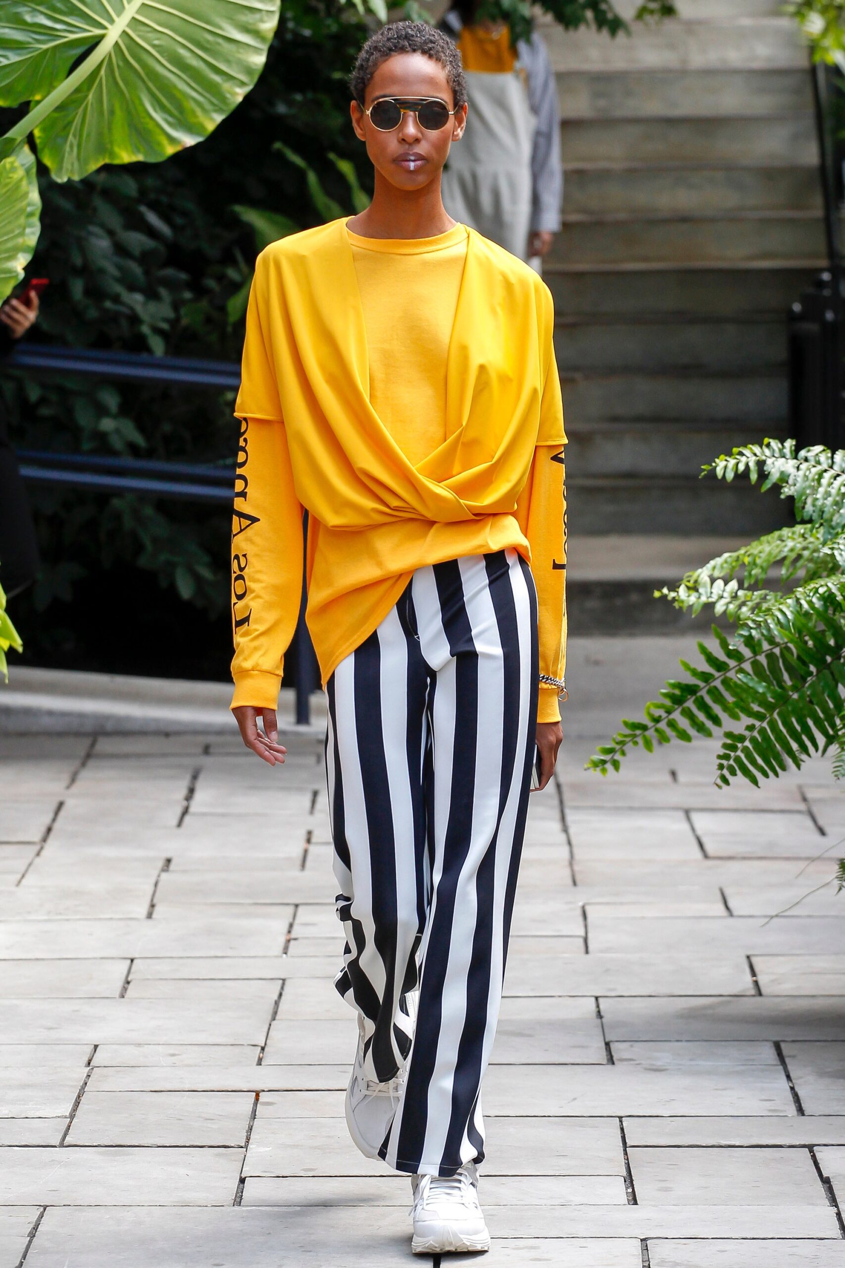 yellow relaxed top with striped pants