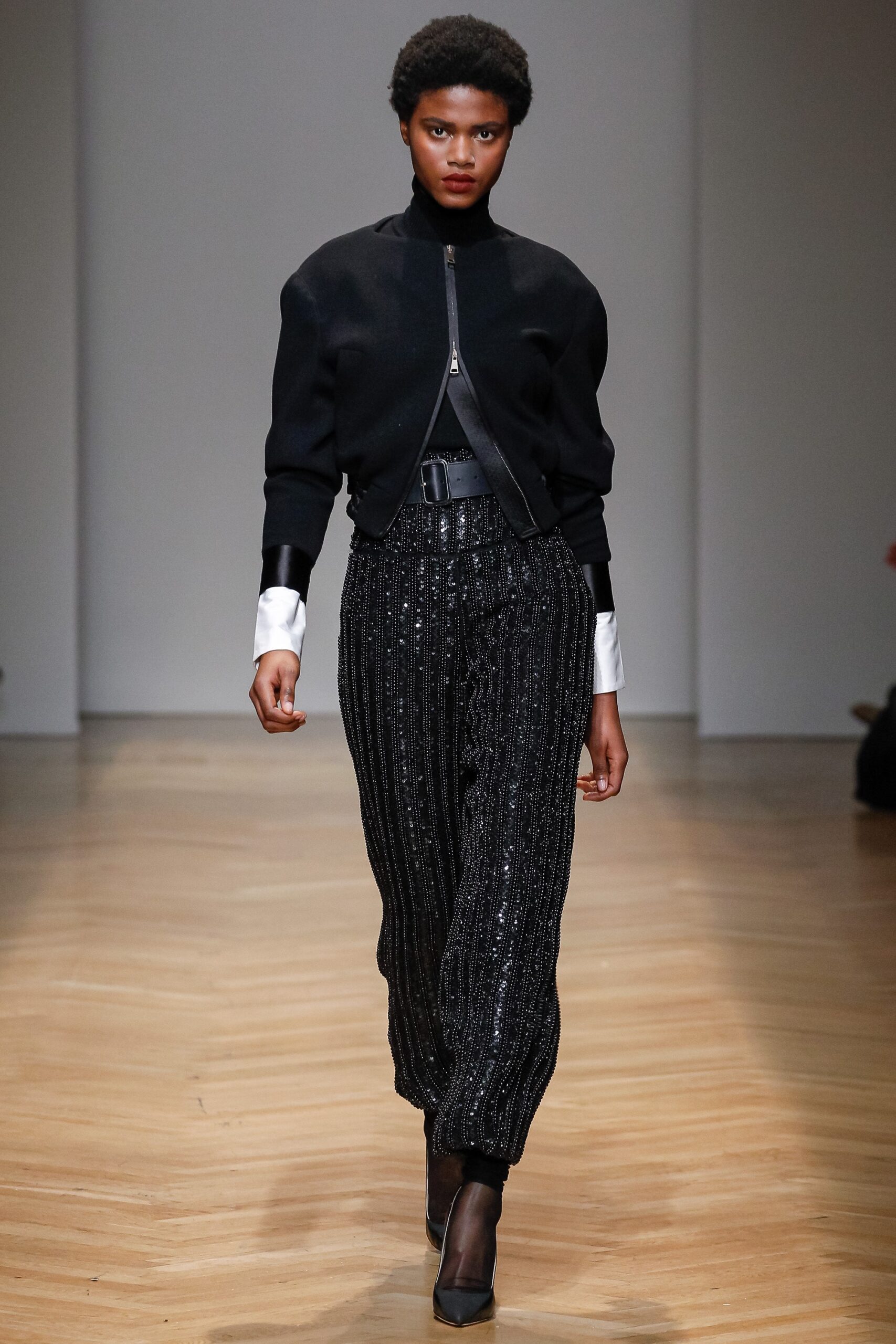 black fitted jacket with pleated pants