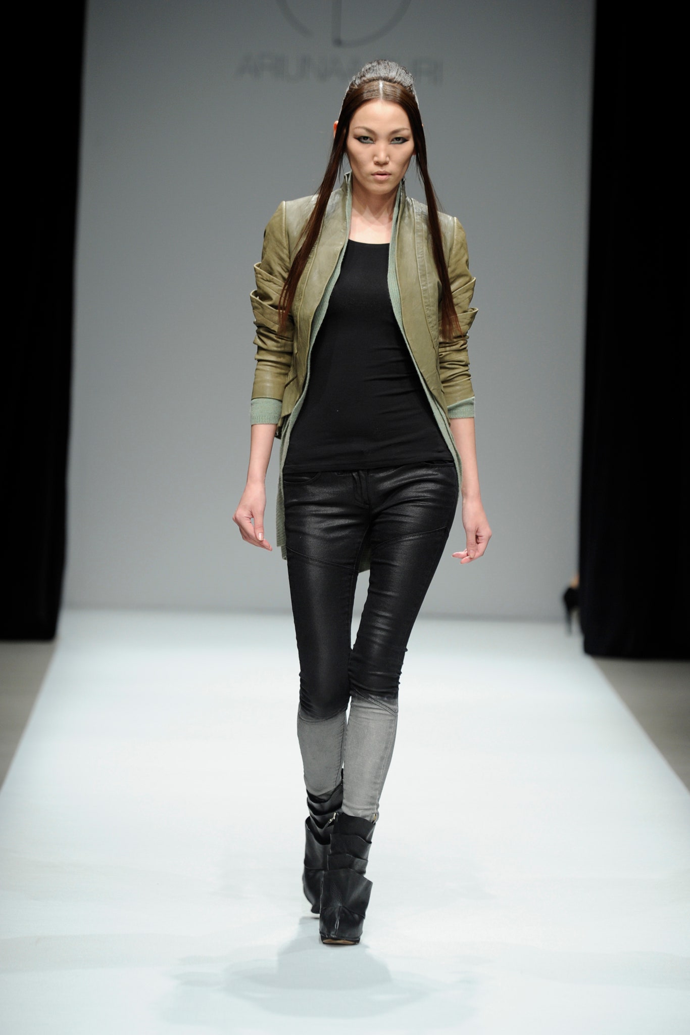fitted green leather jacket with black top