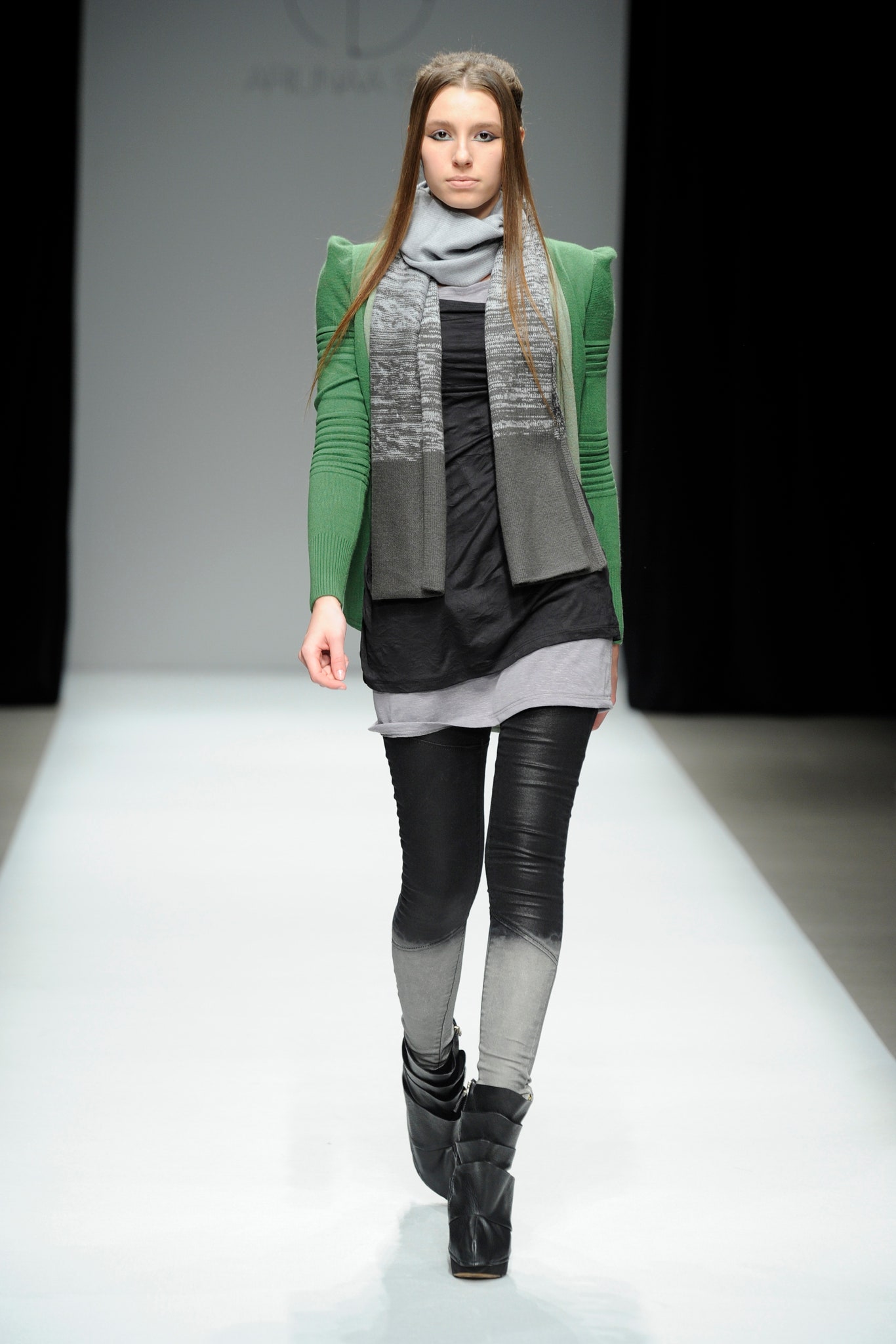 black fitted top with green sweater