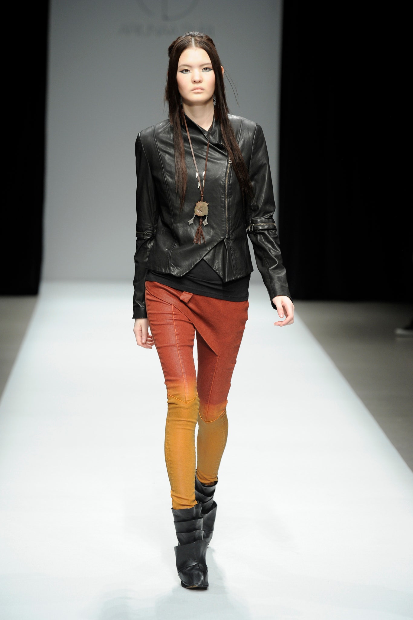 black leather fitted jacket with color-blocked pants
