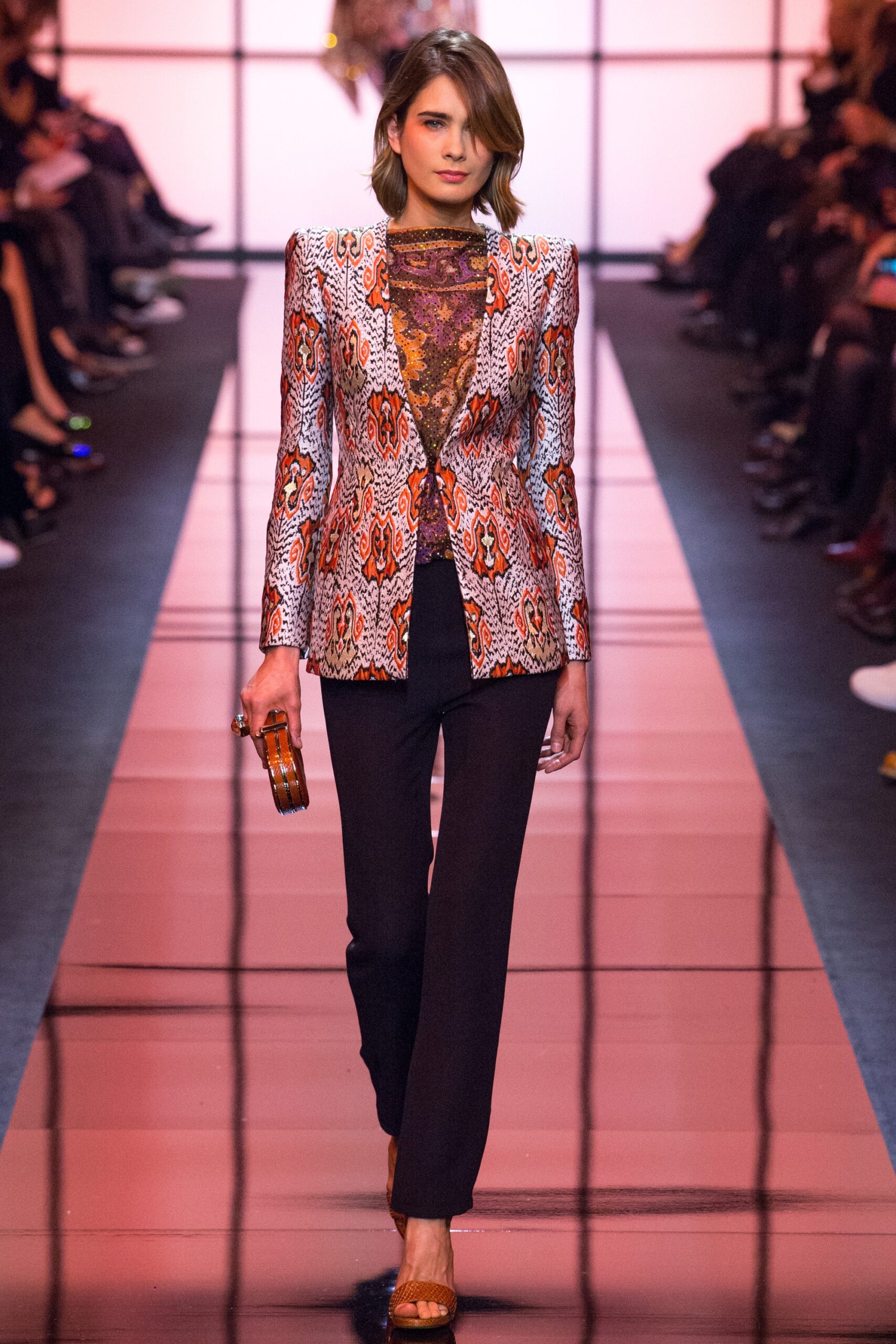 printed orange blazer with black pants