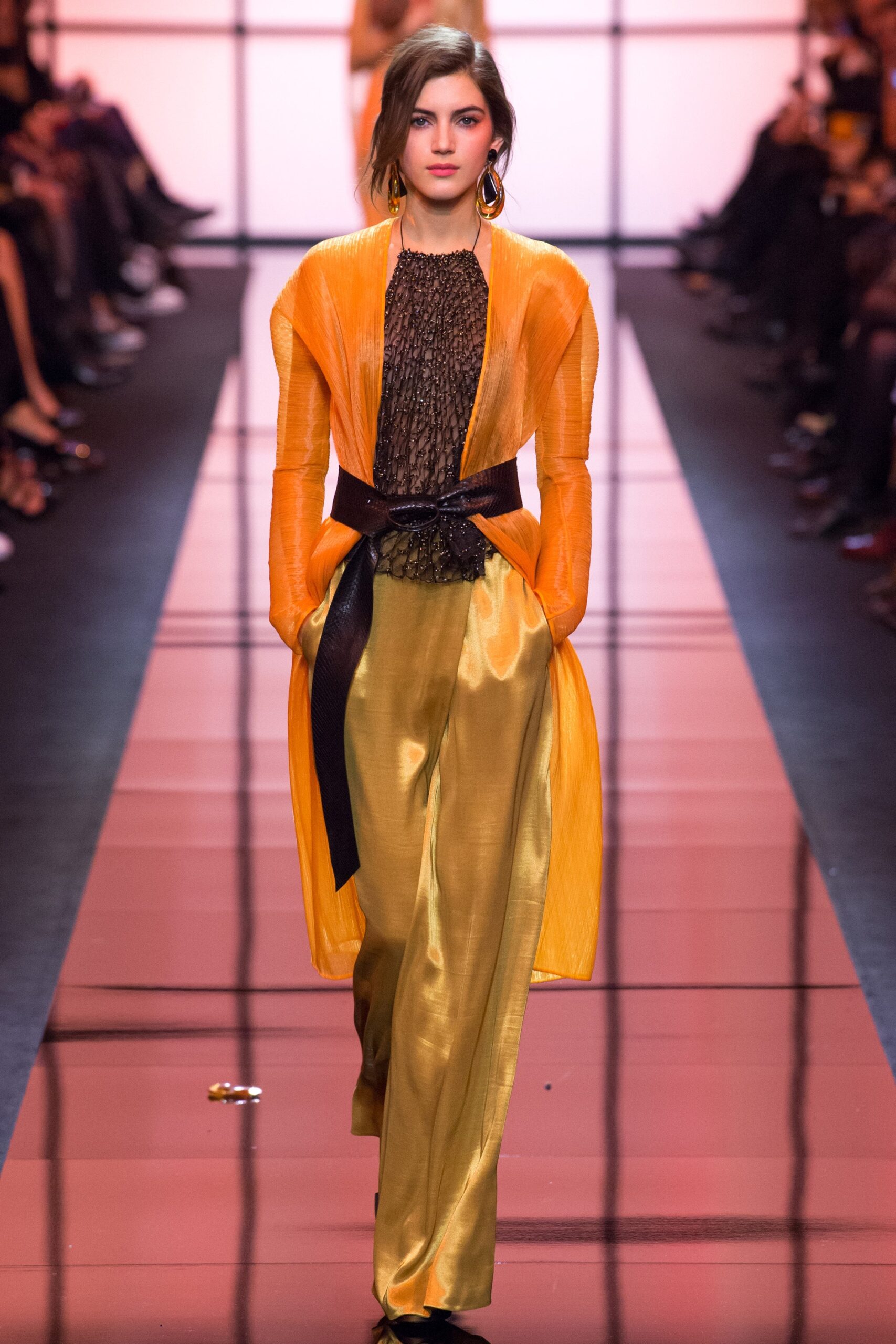 gold relaxed pants with black lace blouse