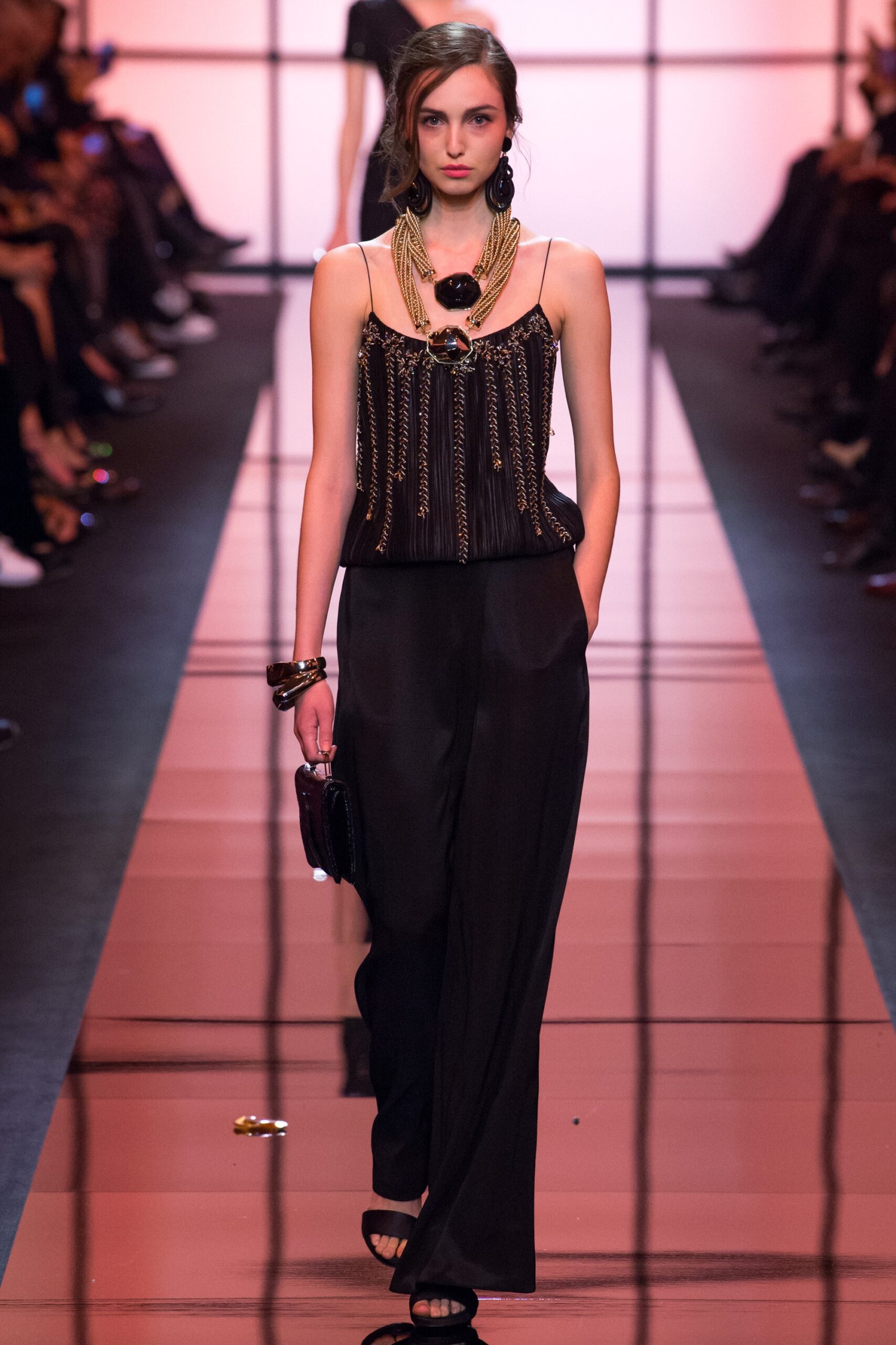 black silk sleeveless top and wide-leg pants