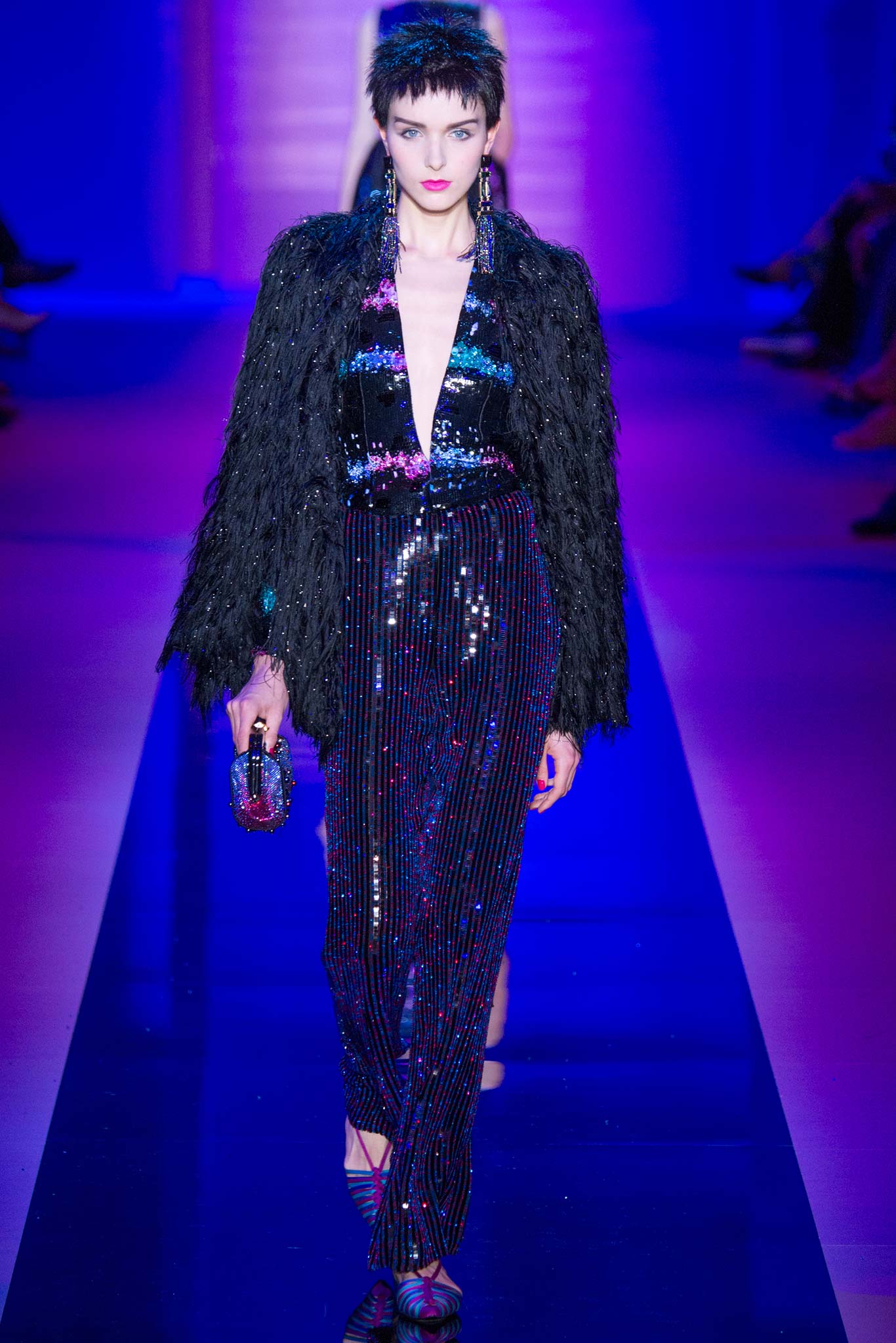 black sequined jumpsuit with fur coat