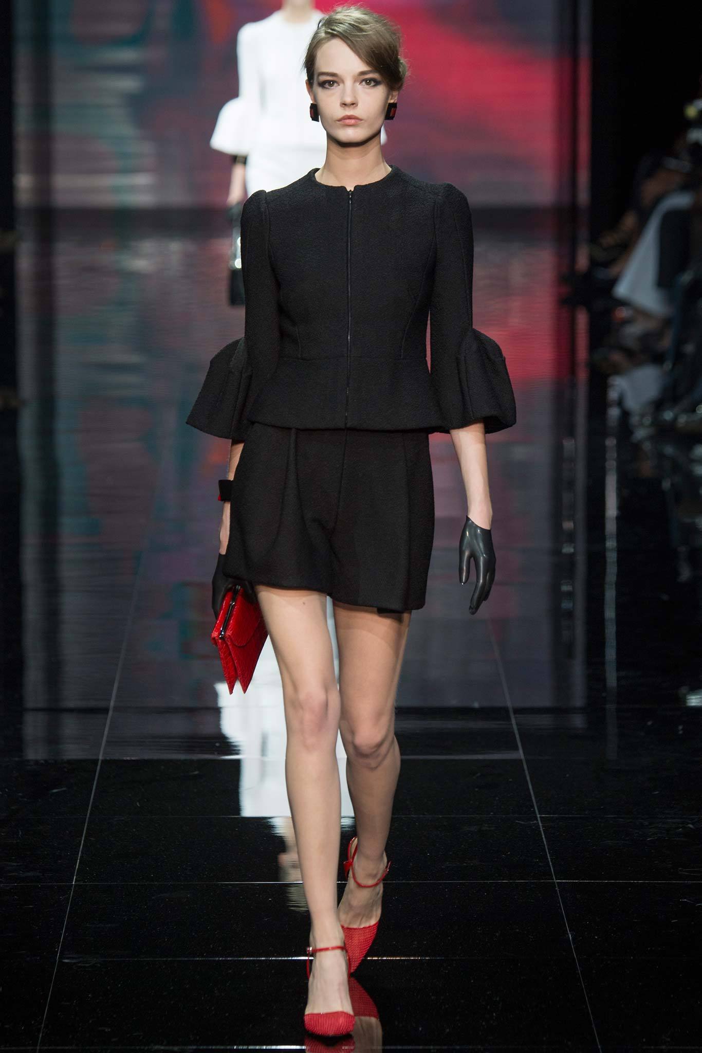 black fitted dress with red accessories