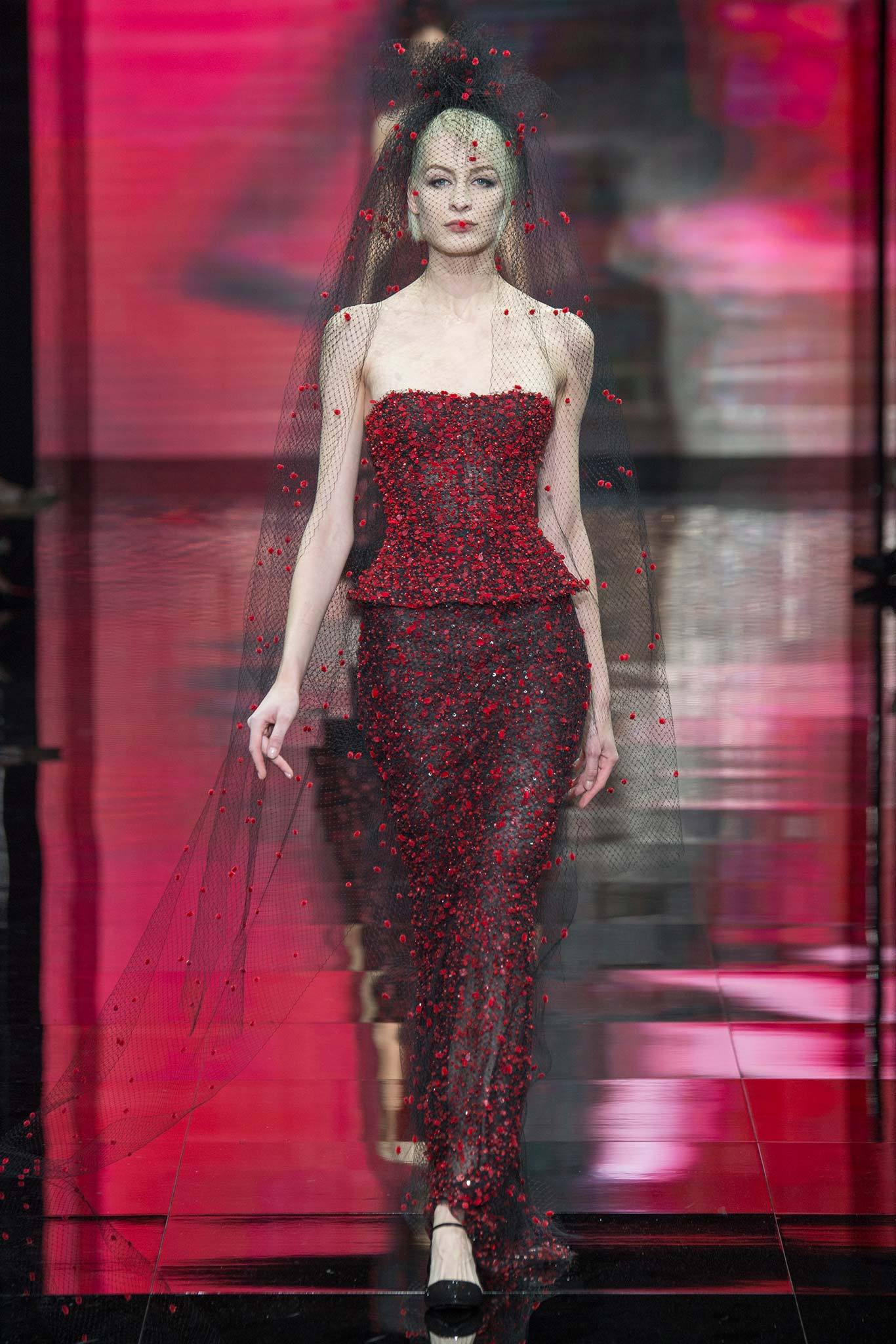 red embroidered gown with black veil