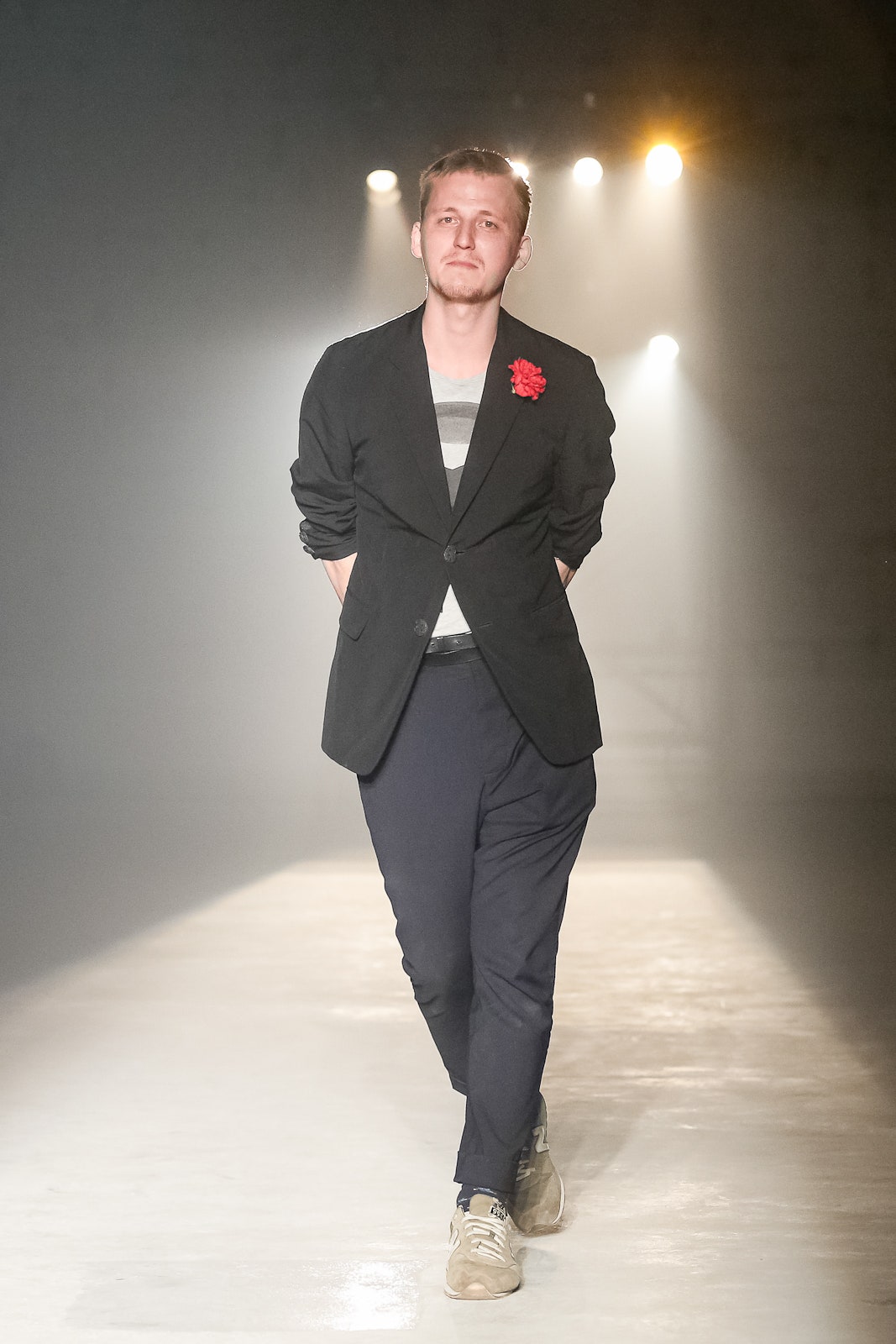 black tailored blazer with navy pants