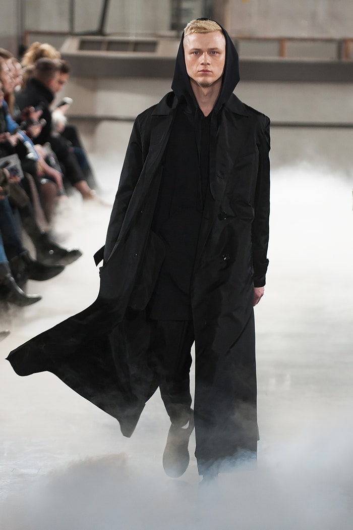 black relaxed coat and fitted hoodie