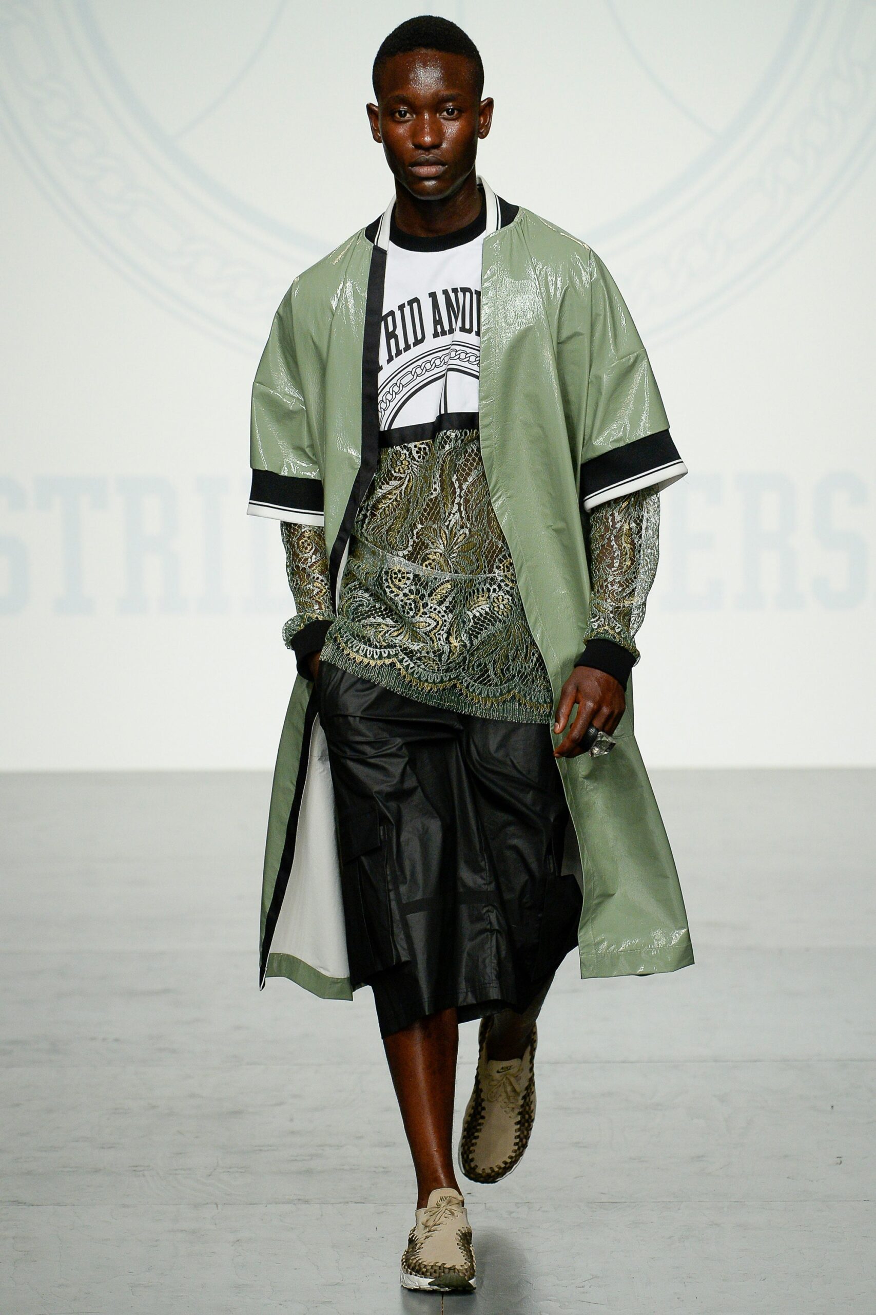 green vinyl coat with black top