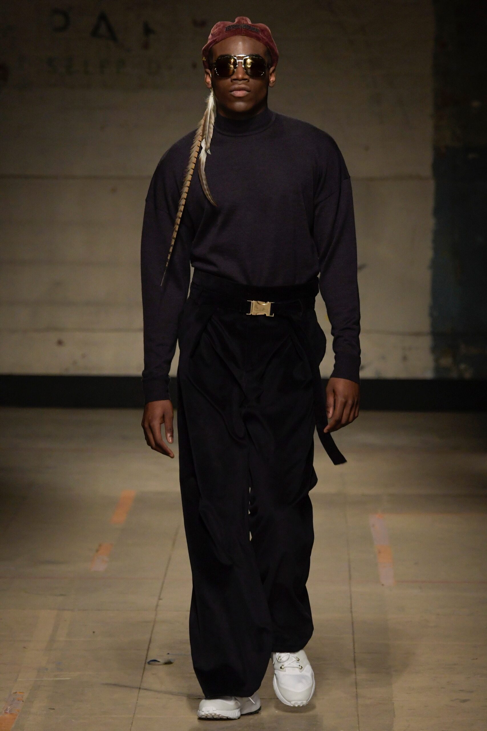 black fitted turtleneck and relaxed pants