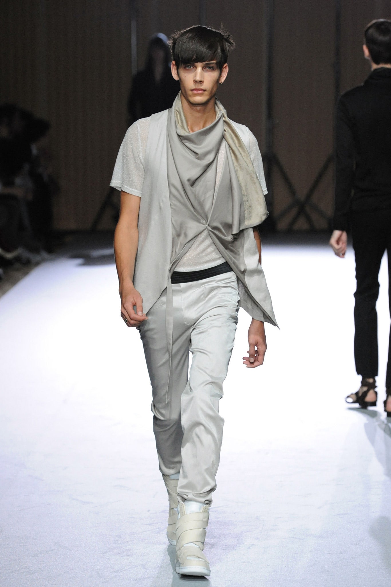 gray fitted vest with white pants