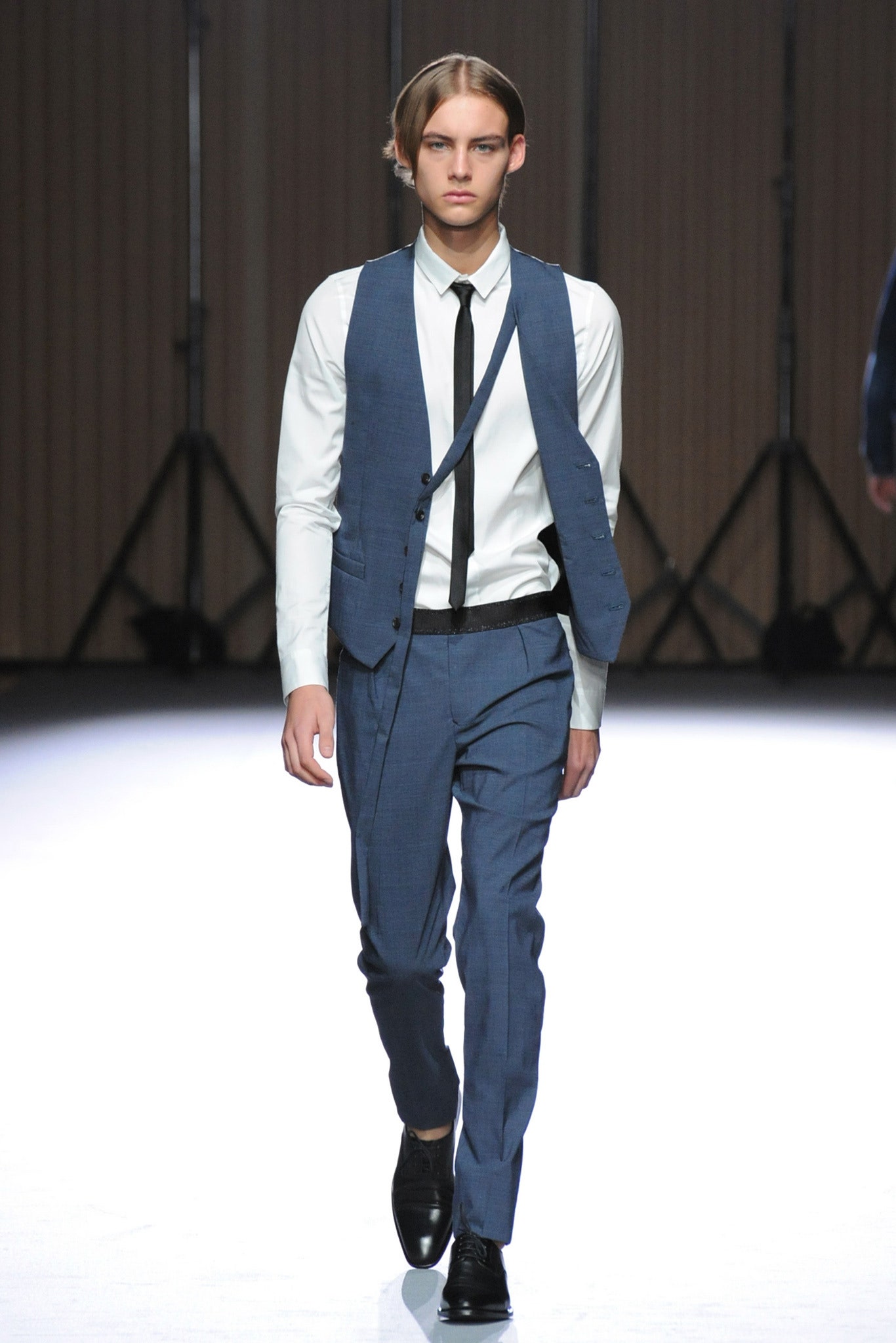 blue fitted vest with white shirt