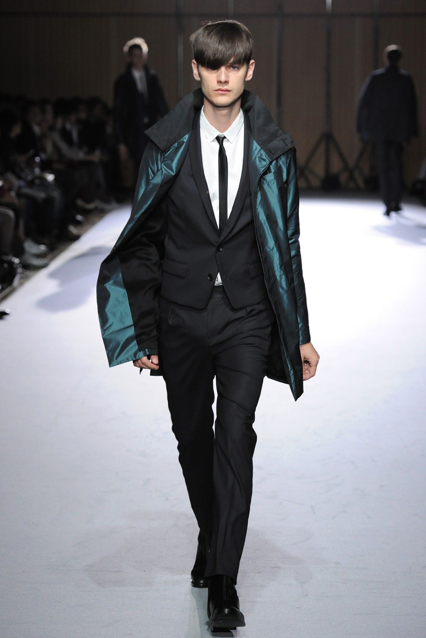 black tailored suit with teal coat