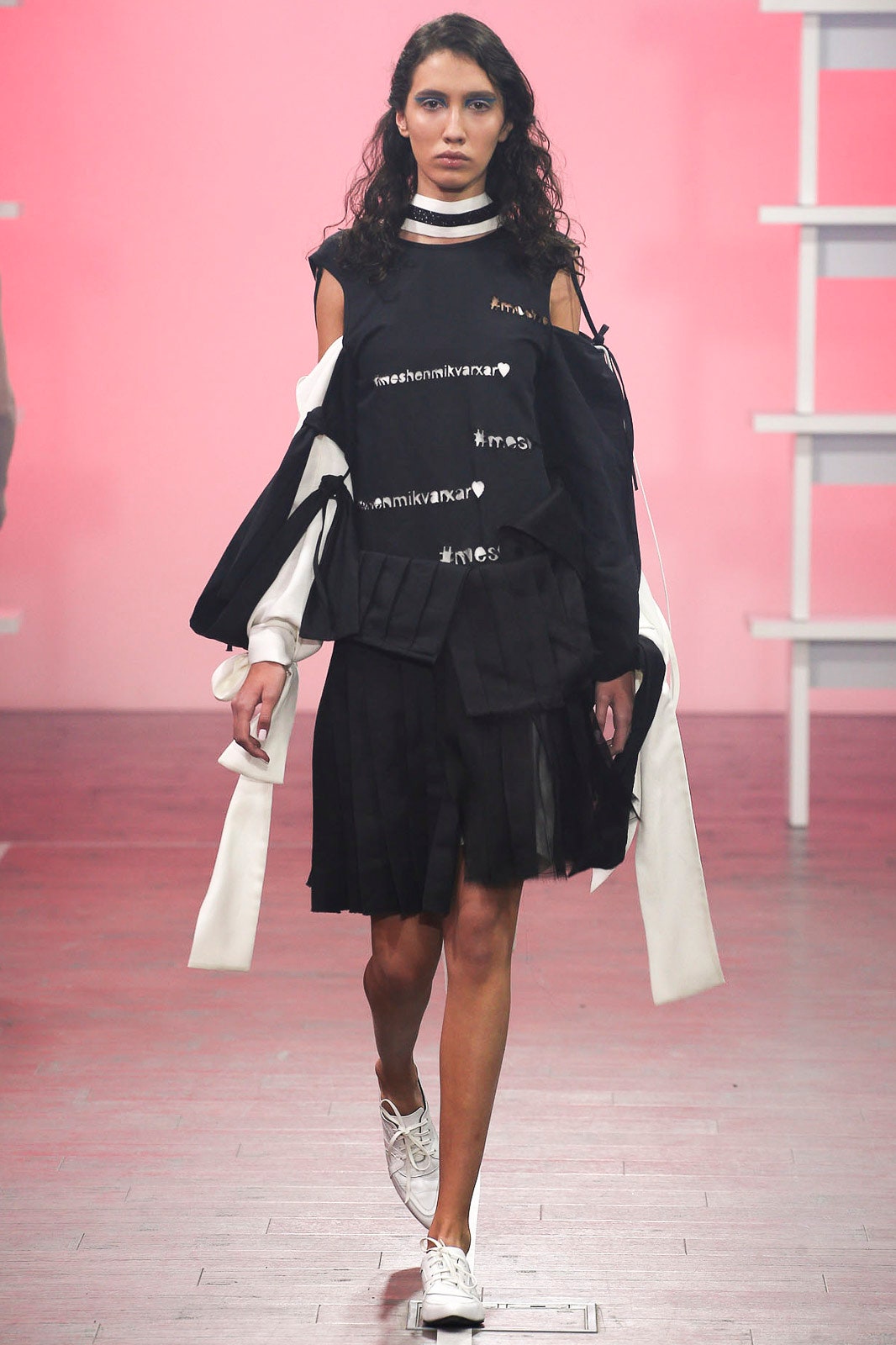 black layered top and pleated skirt