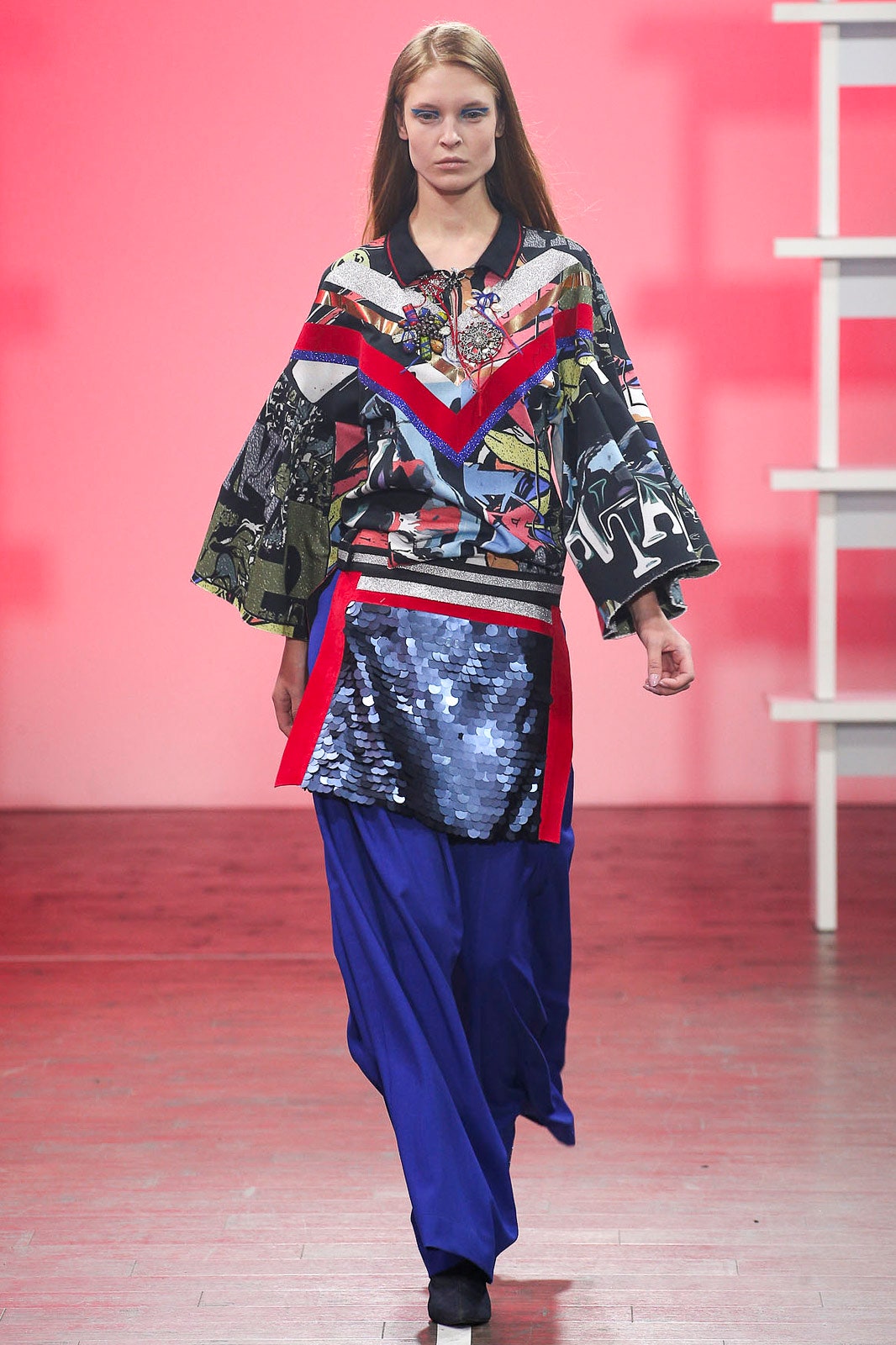 multi-colored relaxed top with blue pants