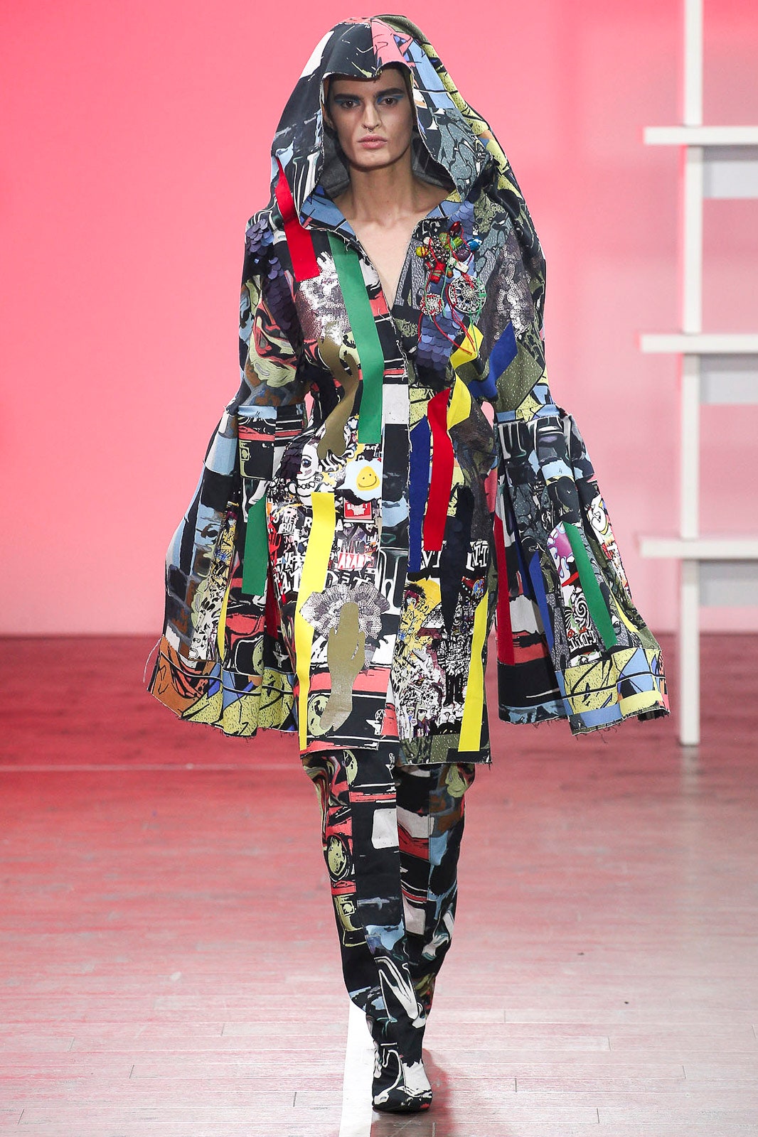 multi-colored hooded coat and fitted pants