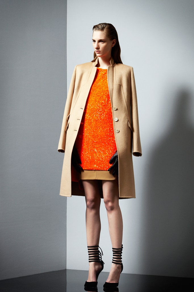 beige wool coat and orange sequin dress