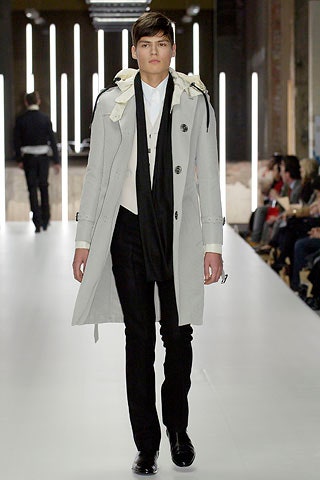 gray tailored coat with black pants