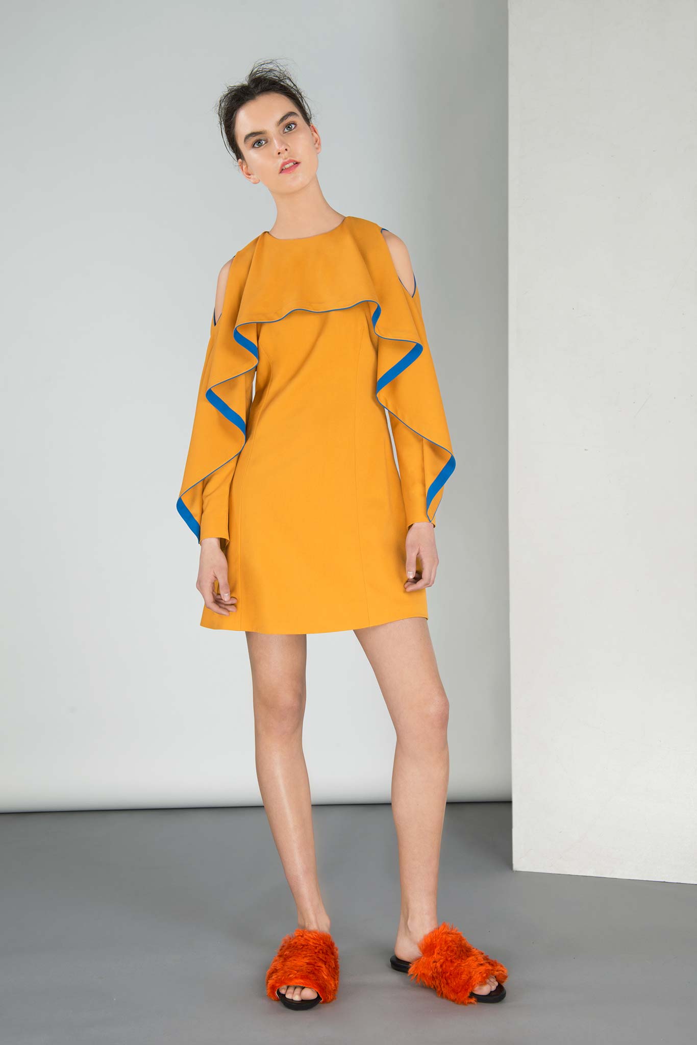 yellow ruffled dress with orange shoes