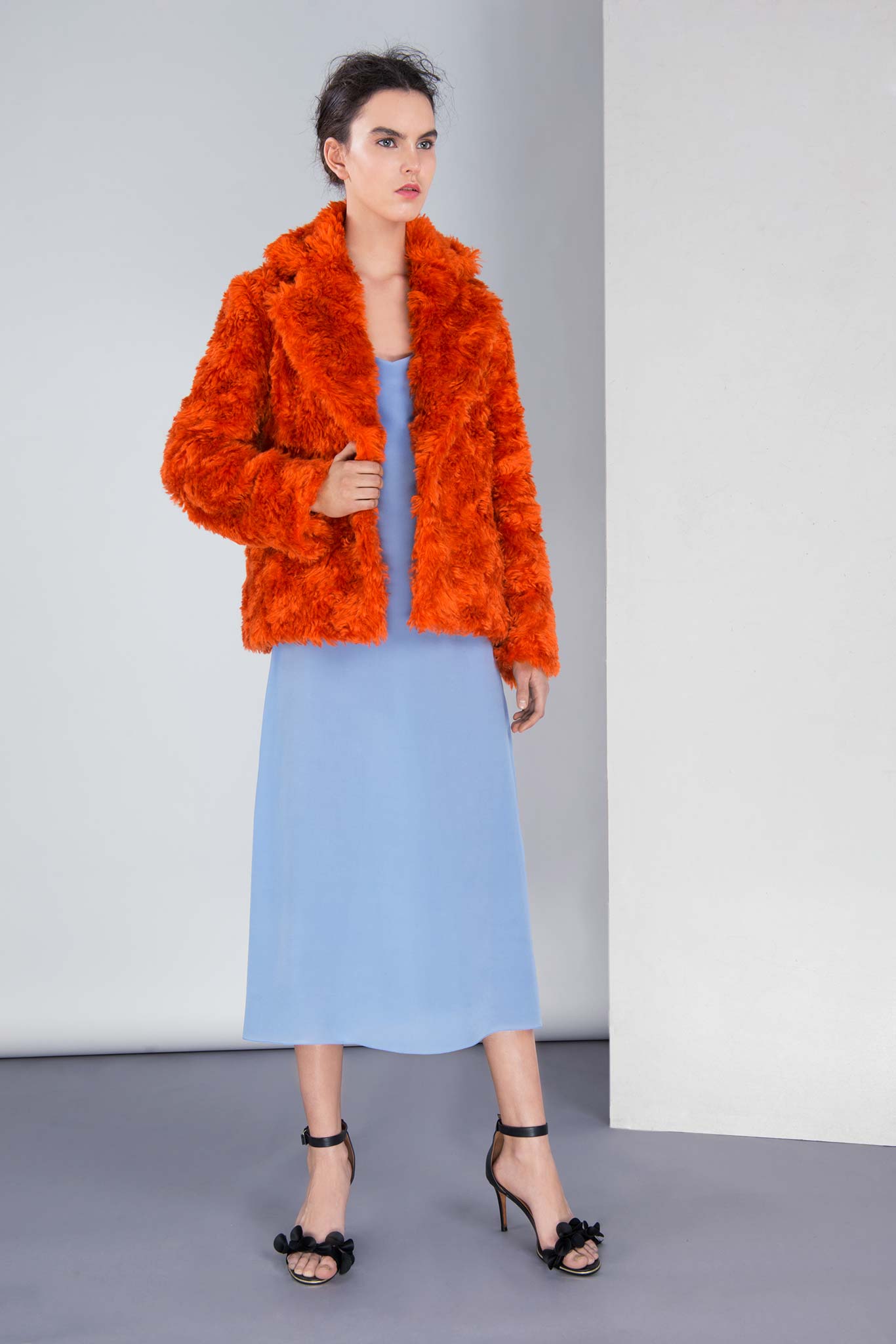 orange faux-fur coat and blue midi dress