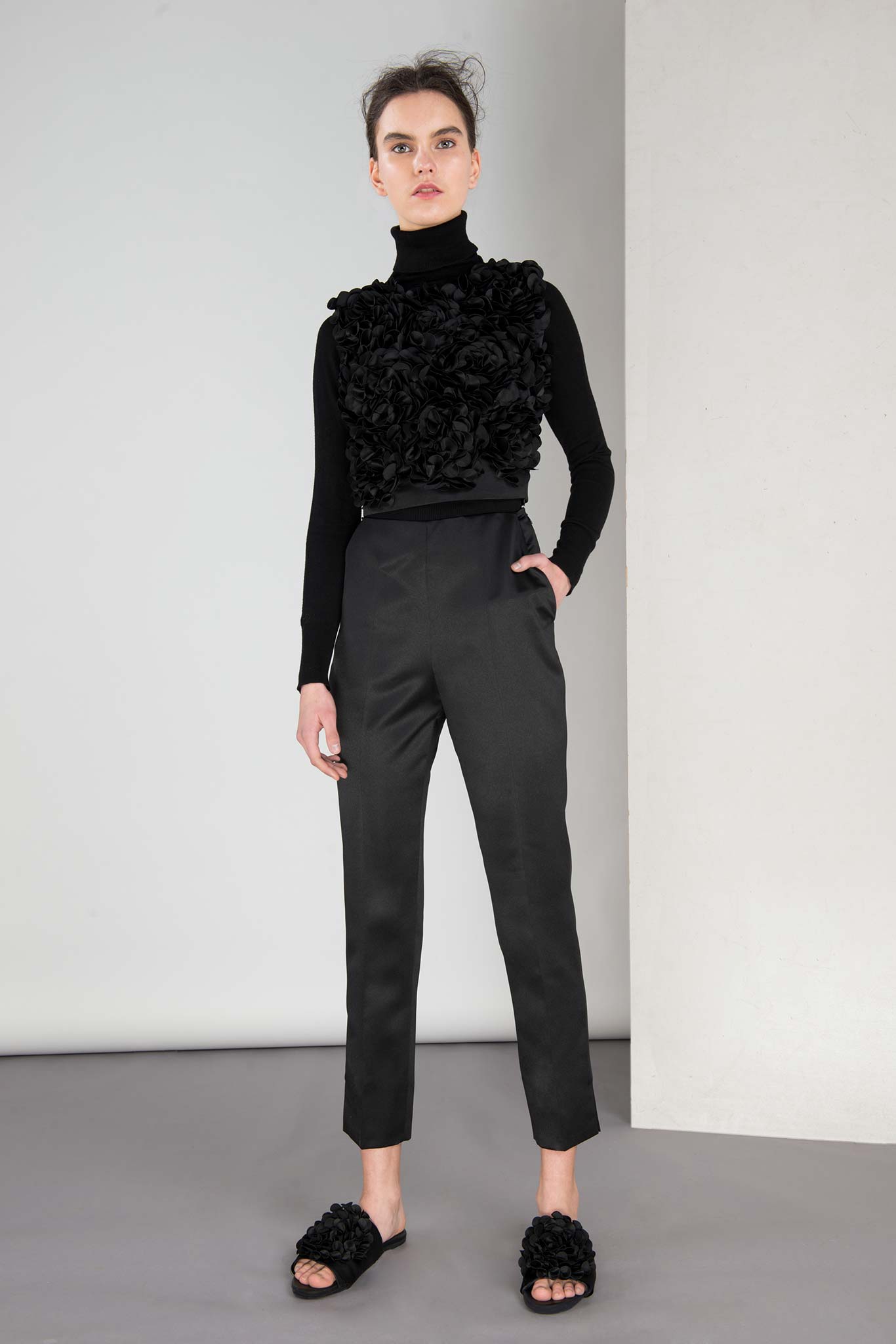 black embellished top and tailored pants