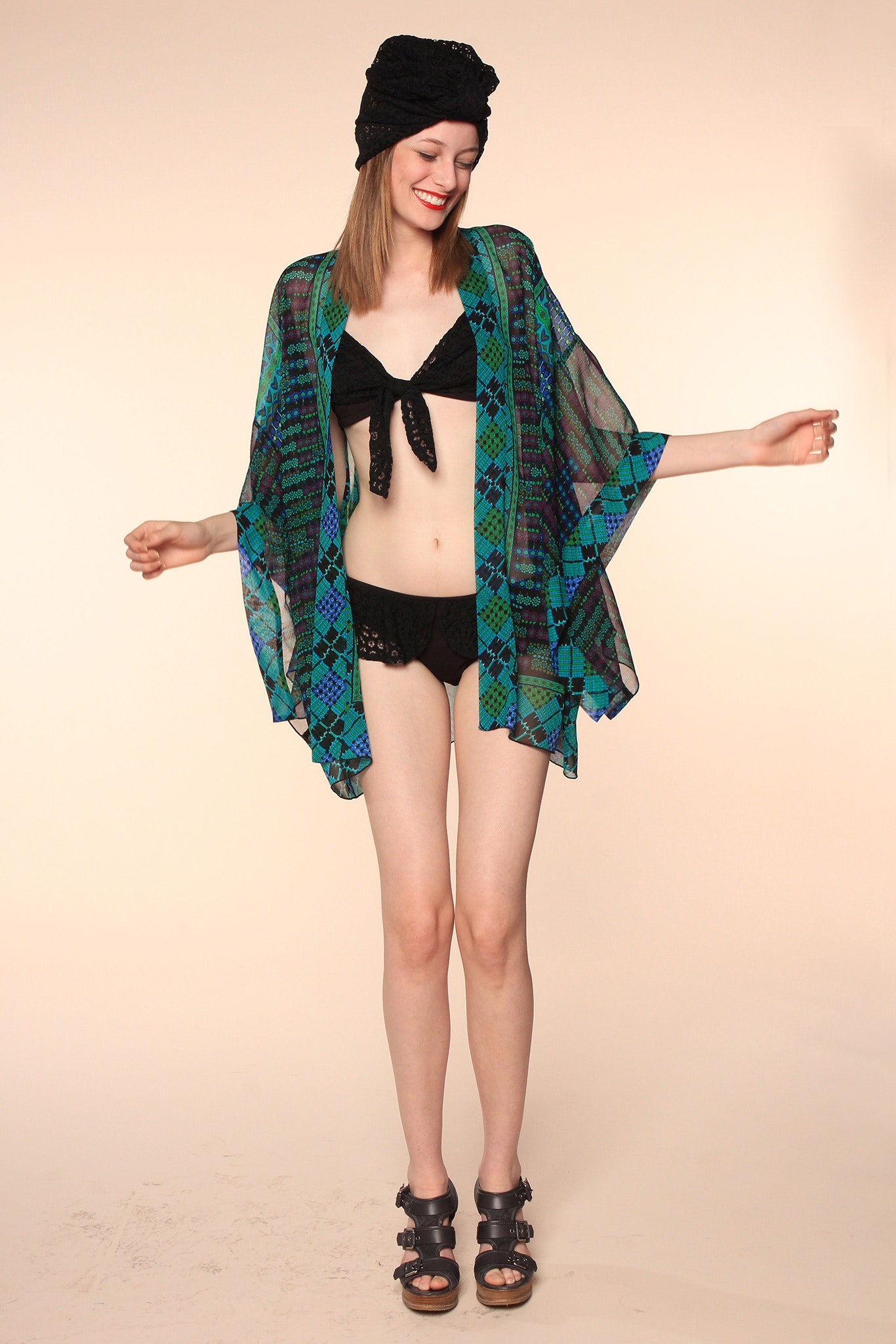 black swimsuit with sheer cape