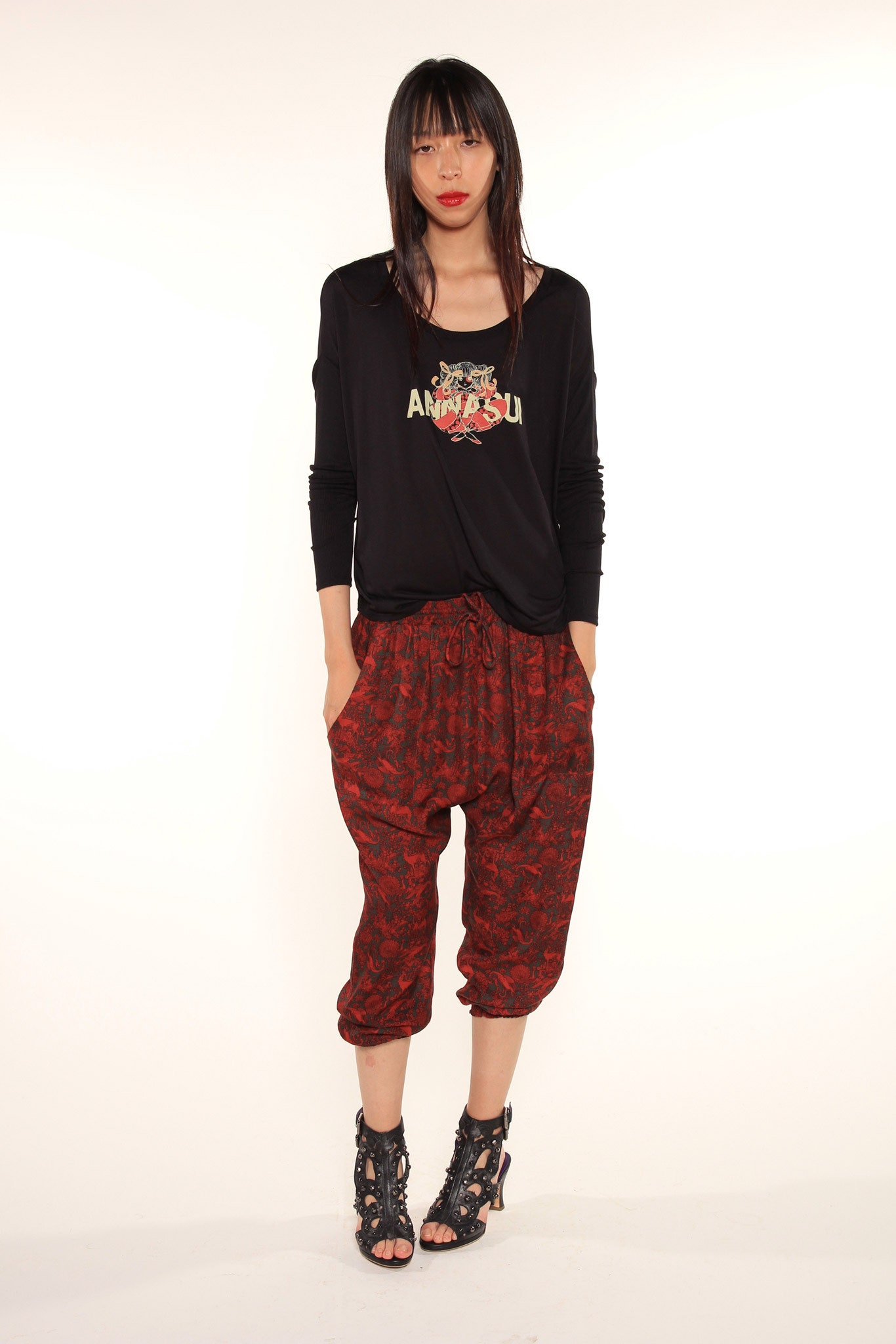 black relaxed top with red pants