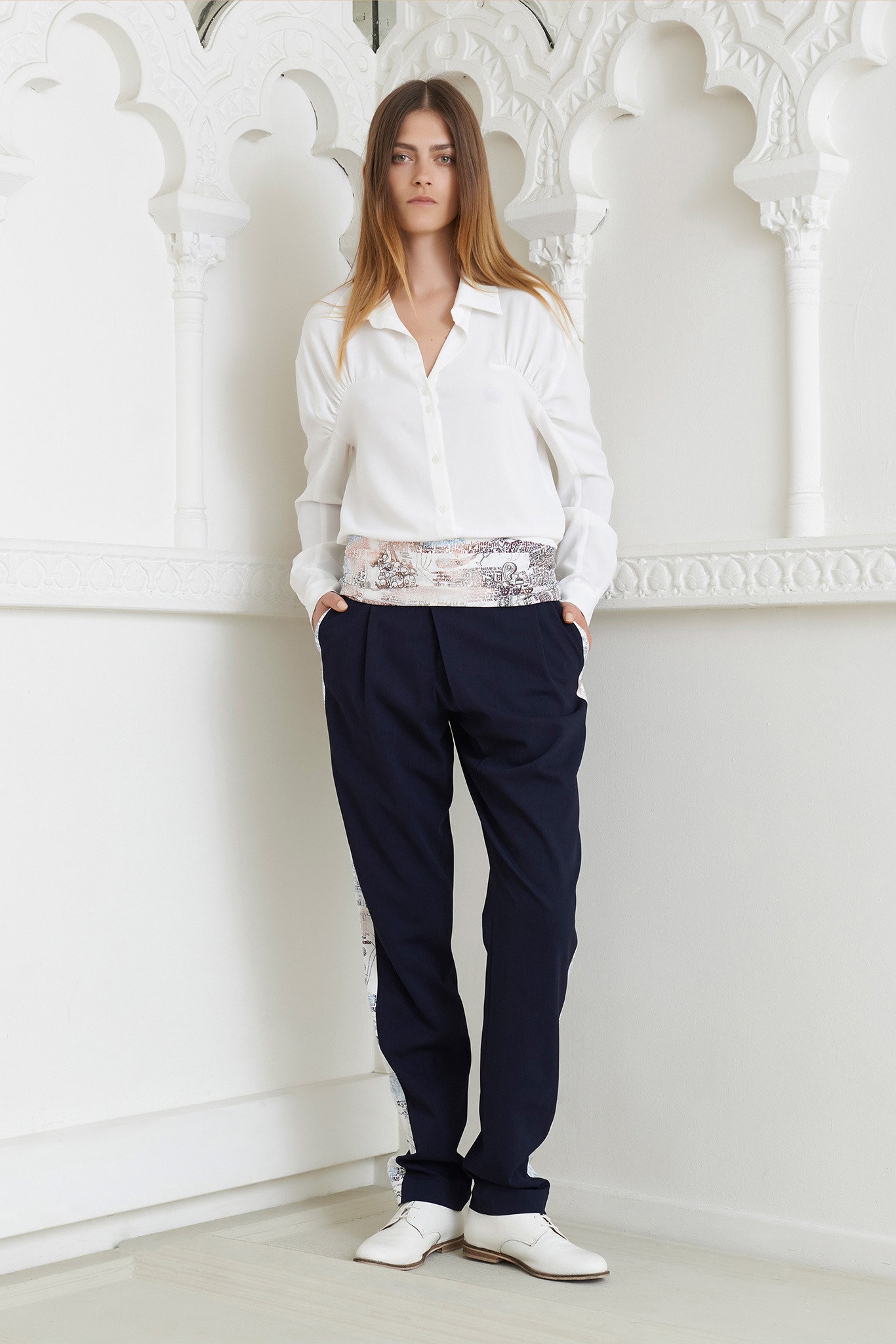 white relaxed shirt and navy pants