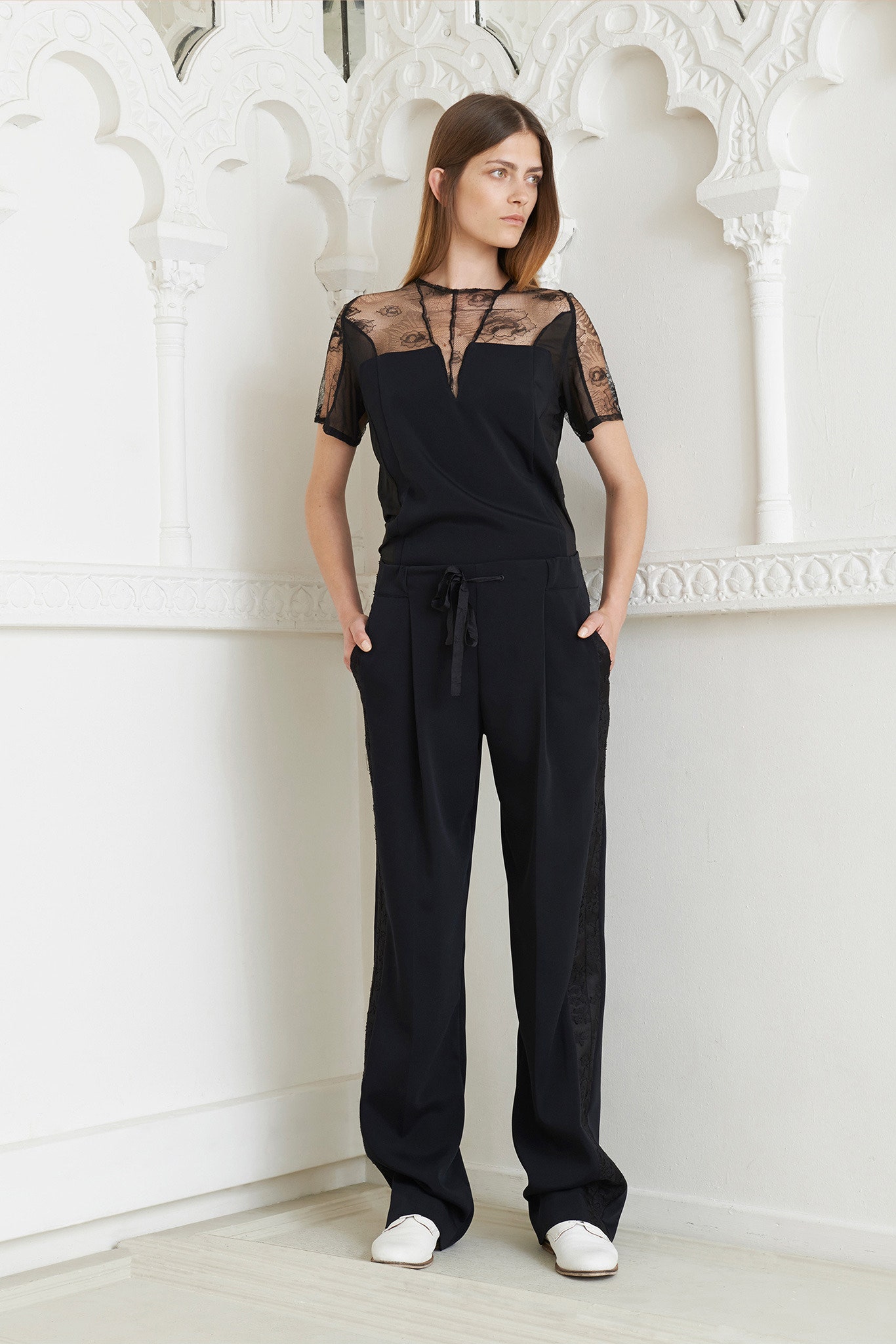 black sheer top and relaxed pants